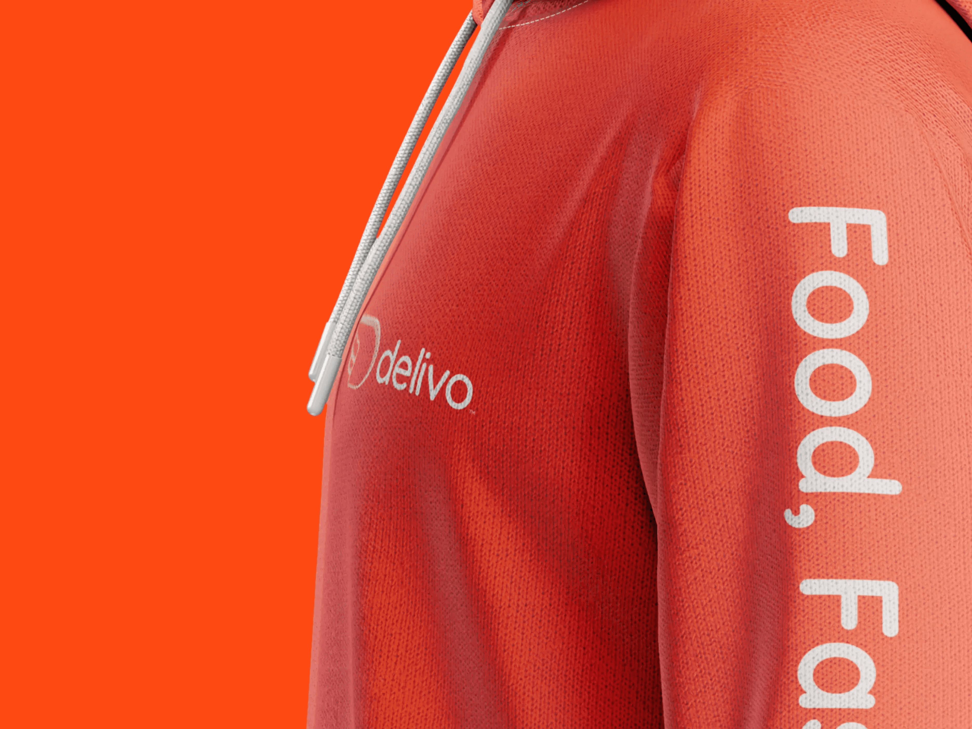 Close-up of a red hoodie with 'delivo' logo and partial slogan on sleeve, set against an orange background