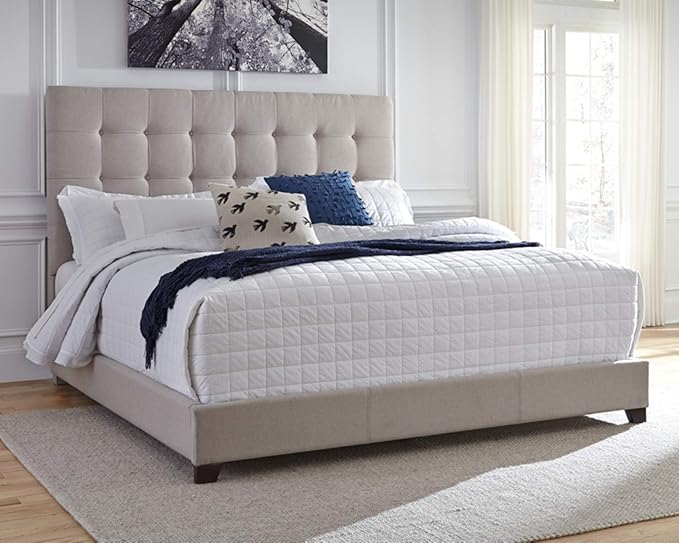 The dolante king upholstered bed blends modern aesthetics with practical design for any setting.