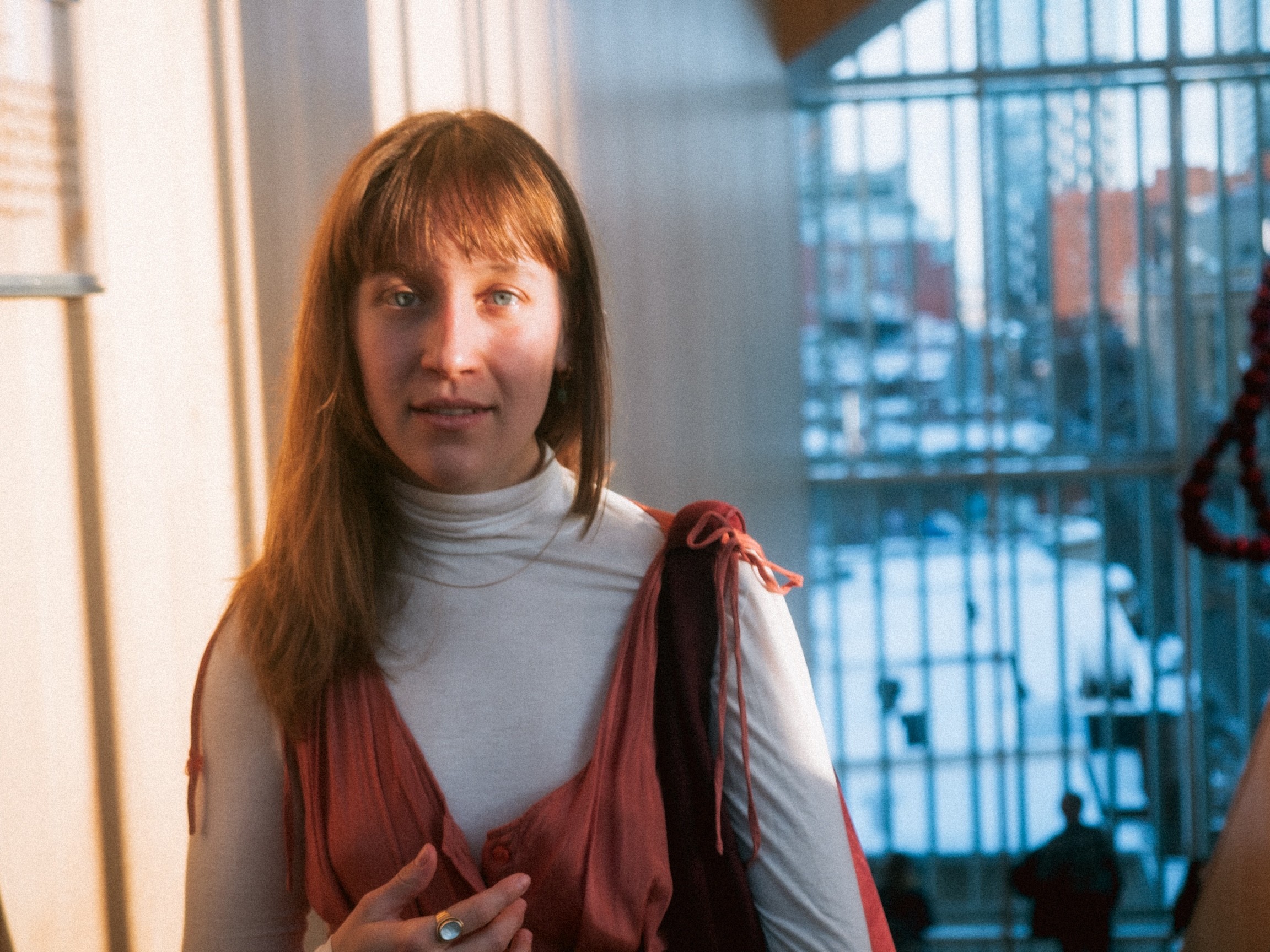 Artistic portrait of a woman in Montreal looking at the camera with a dramatic light highlighting her eyes