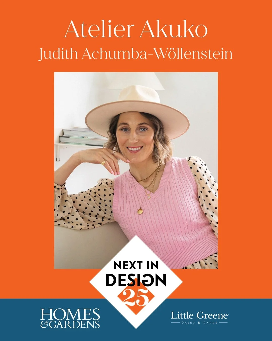 A image by Homes & Gardens, Next in Design, with a woman wearing a pink vest, blouse, and wide-brimmed hat, smiling and sitting indoors against a white wall with a shelf in the background, promoting Atelie Akuko by Judith Achumba-Wöllenstein.