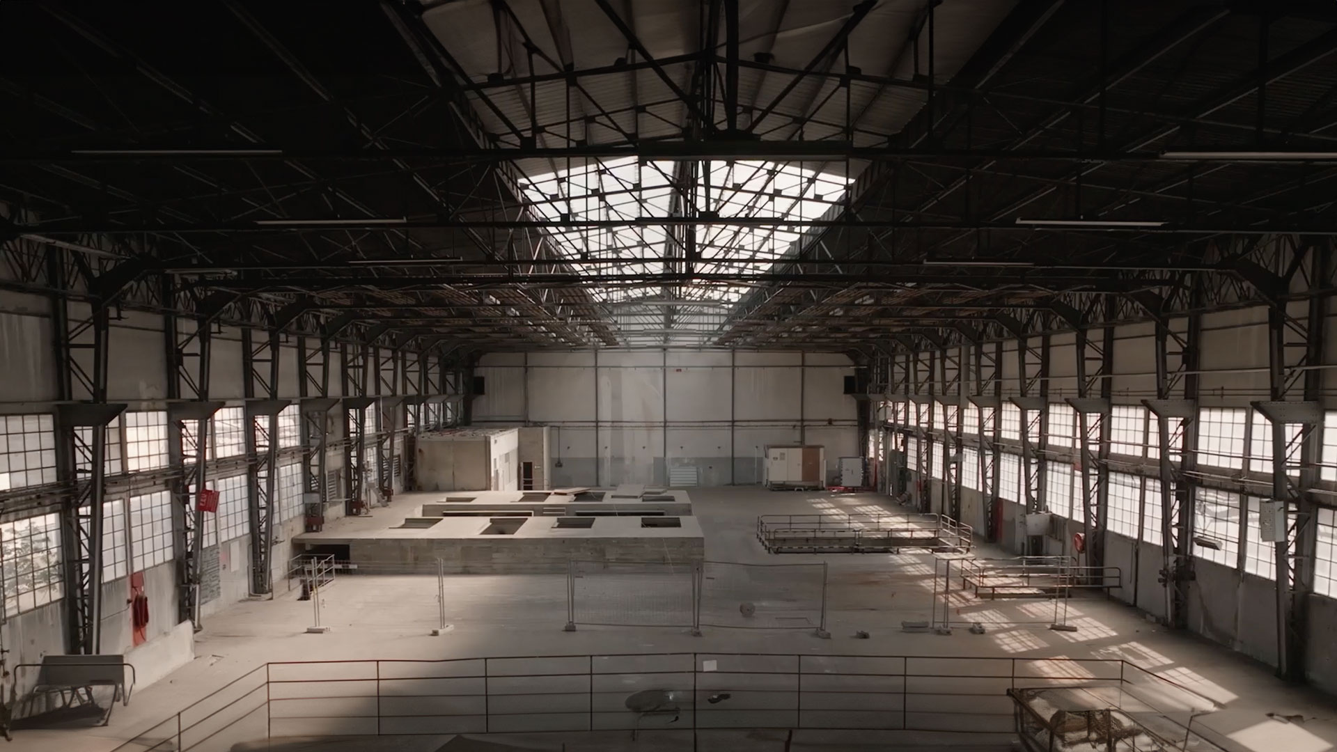 brown and white concrete house near green trees during daytime