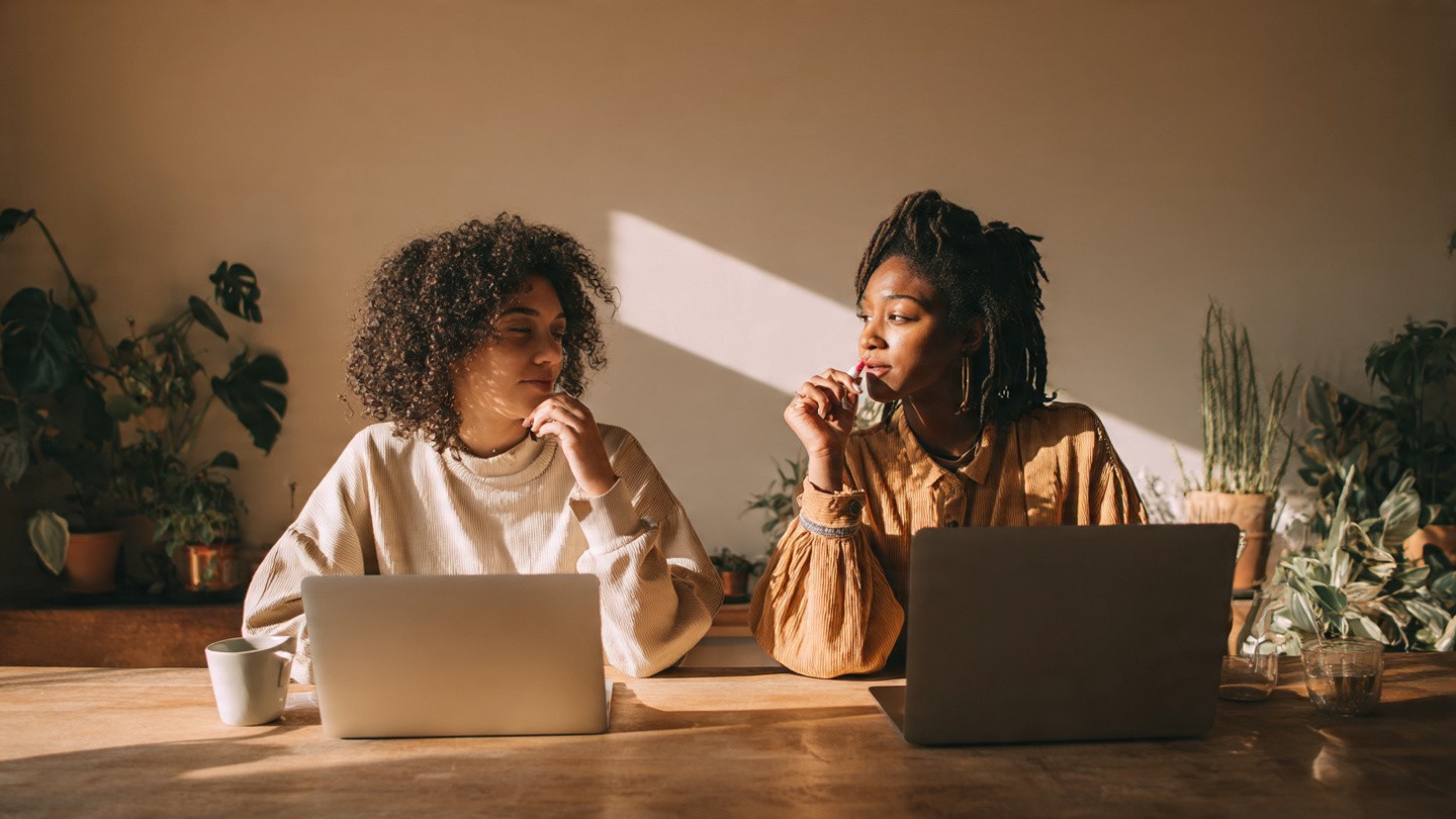 two_friends_at_a_kitchen_table_with