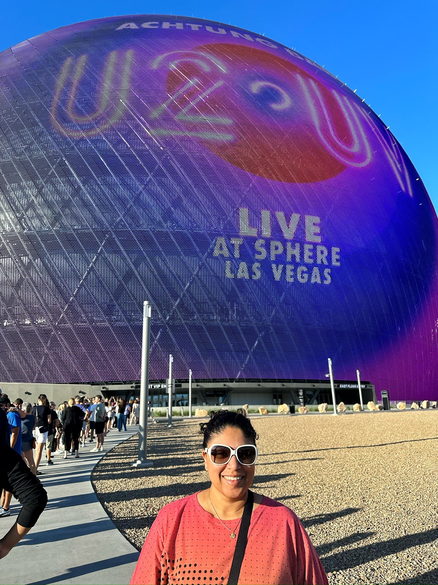 people in a large building with Tate Modern in the background