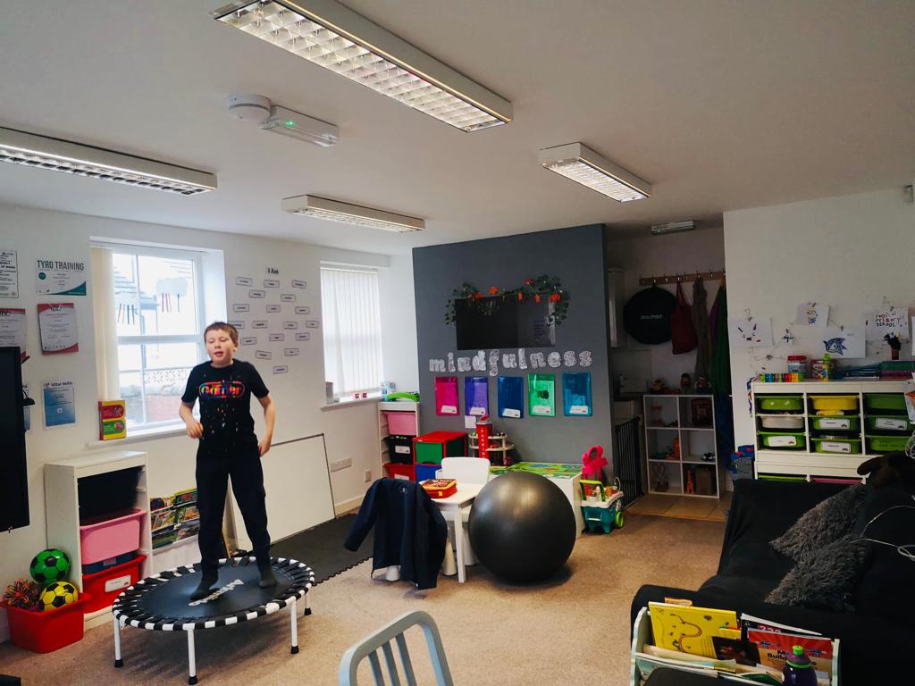 In the Horizon Hub teaching space, a child is playing on a trampoline.