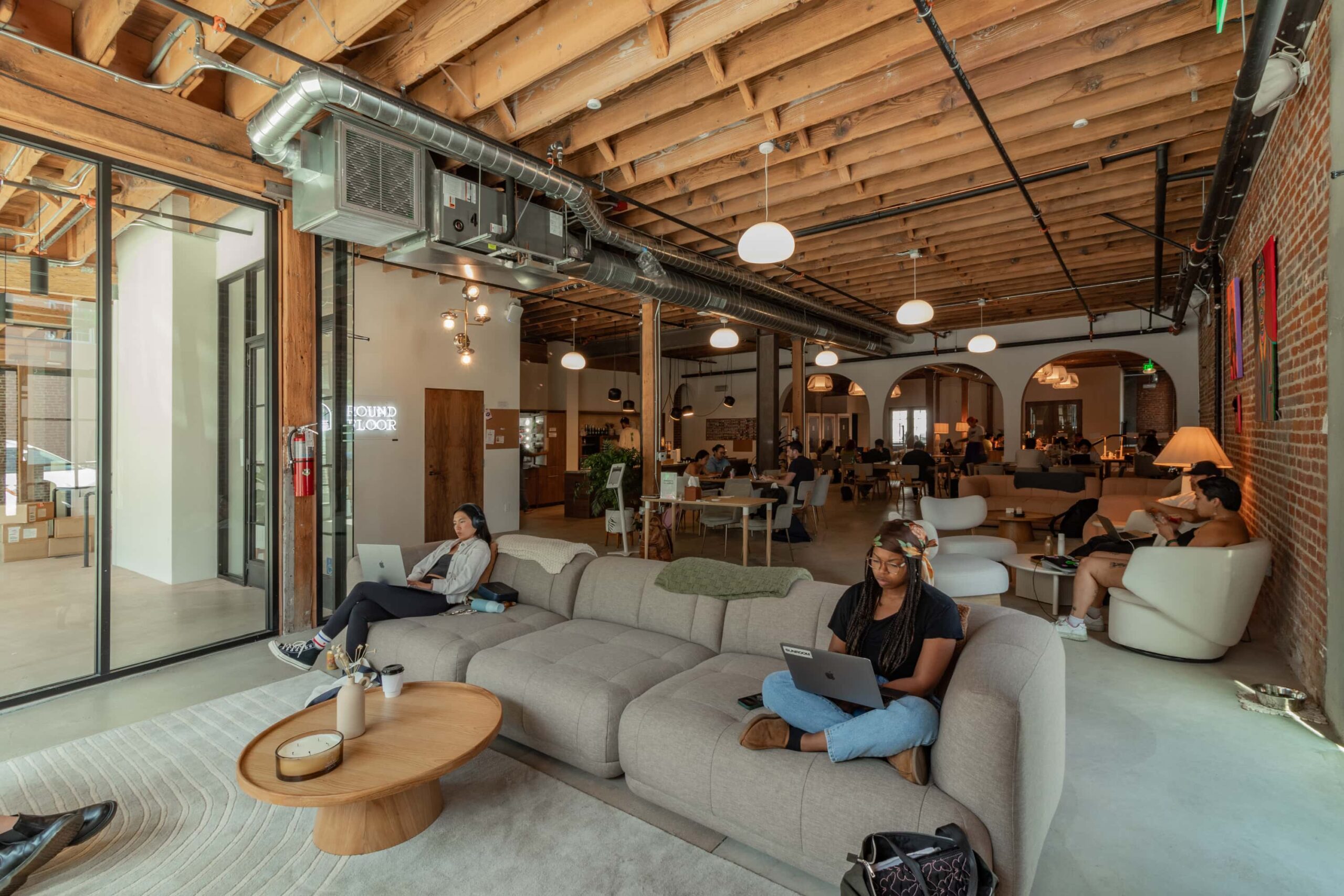 A black and white city scene with a bus.