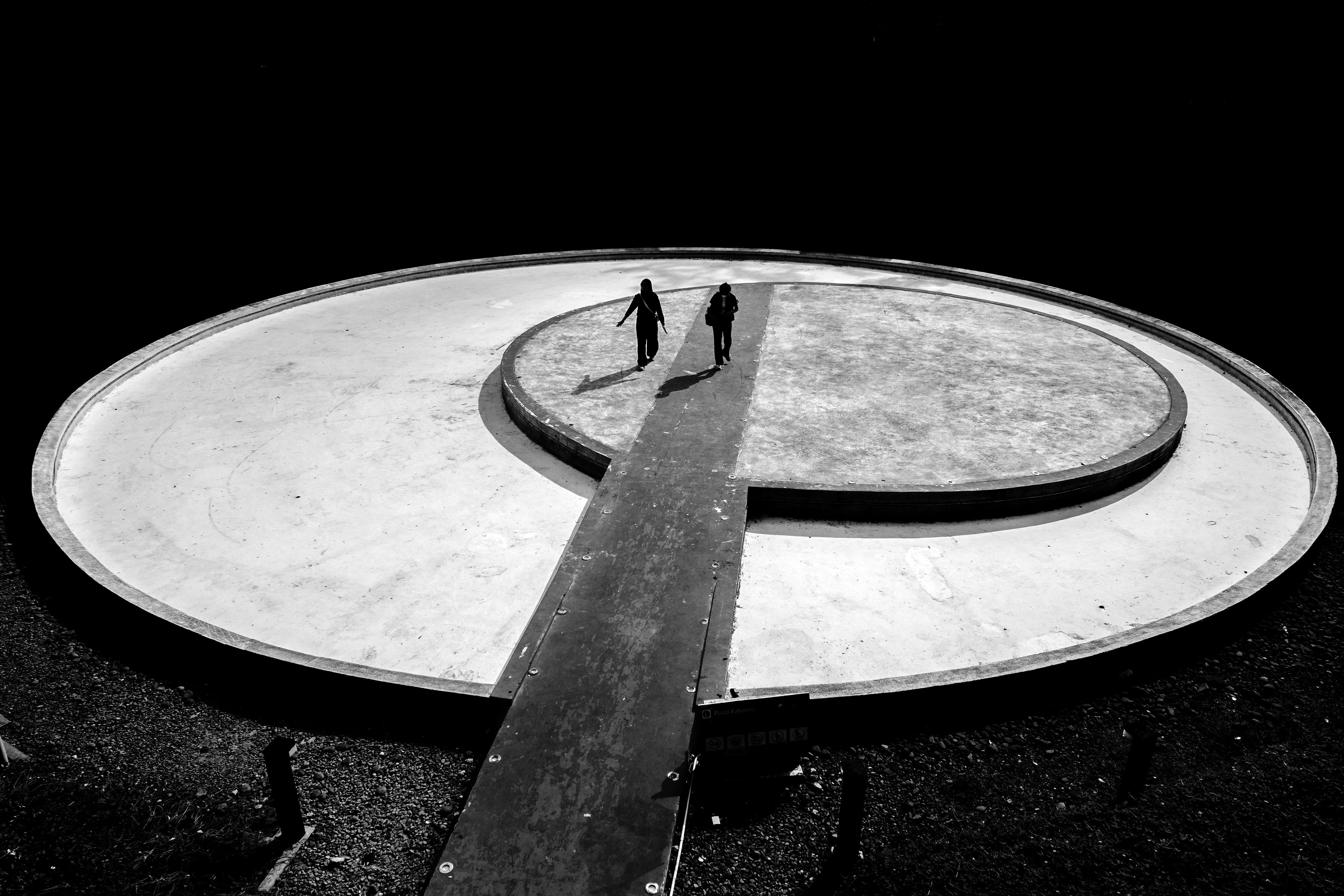 man wearing gray polo shirt beside dry-erase board