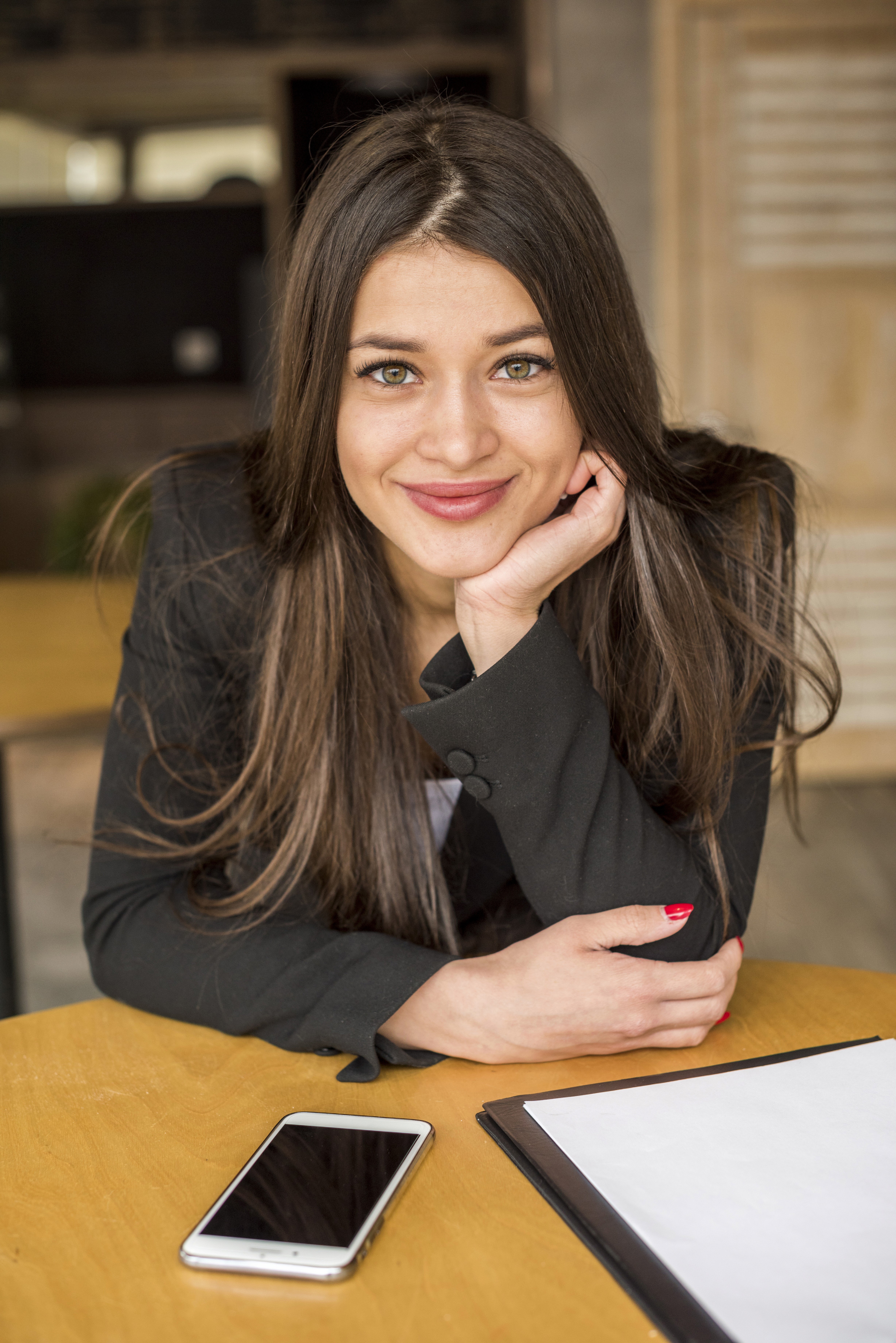 woman smiling at desk