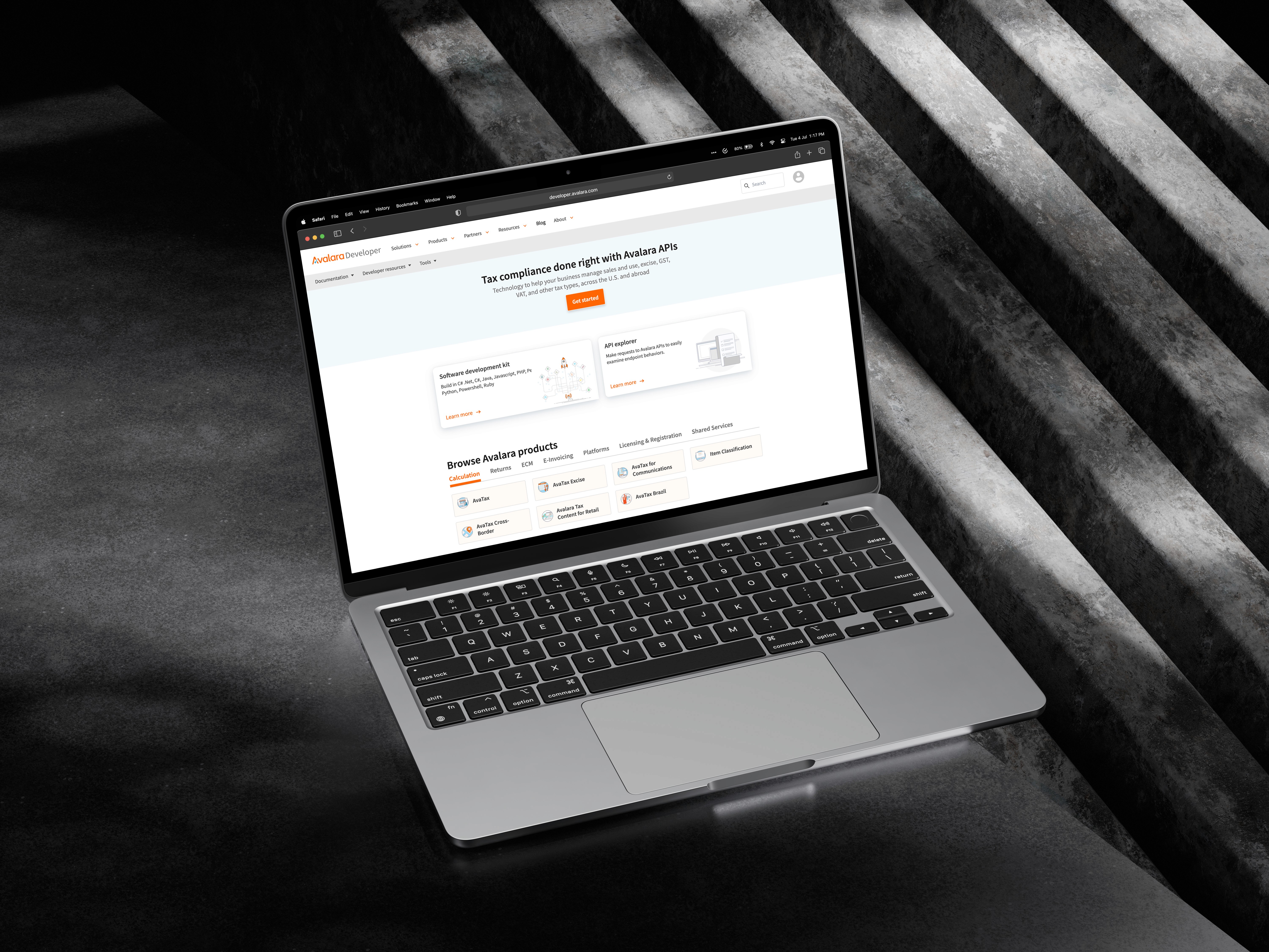 Laptop screen displaying Avalara’s API dashboard for tax compliance tools and developer documentation.