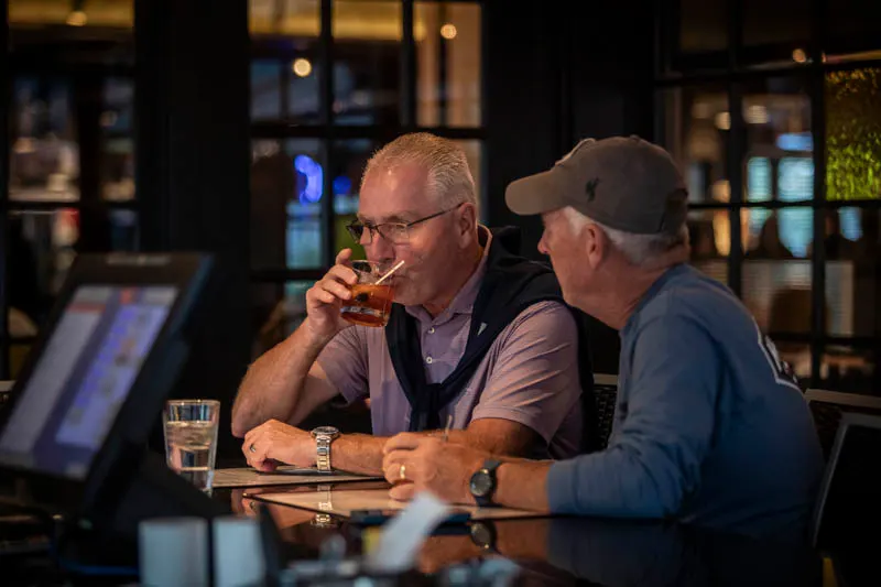 Guests having drinks at the bar