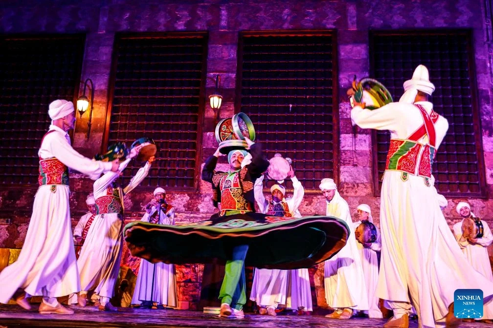 Traditional Tanoura dancers performing on stage