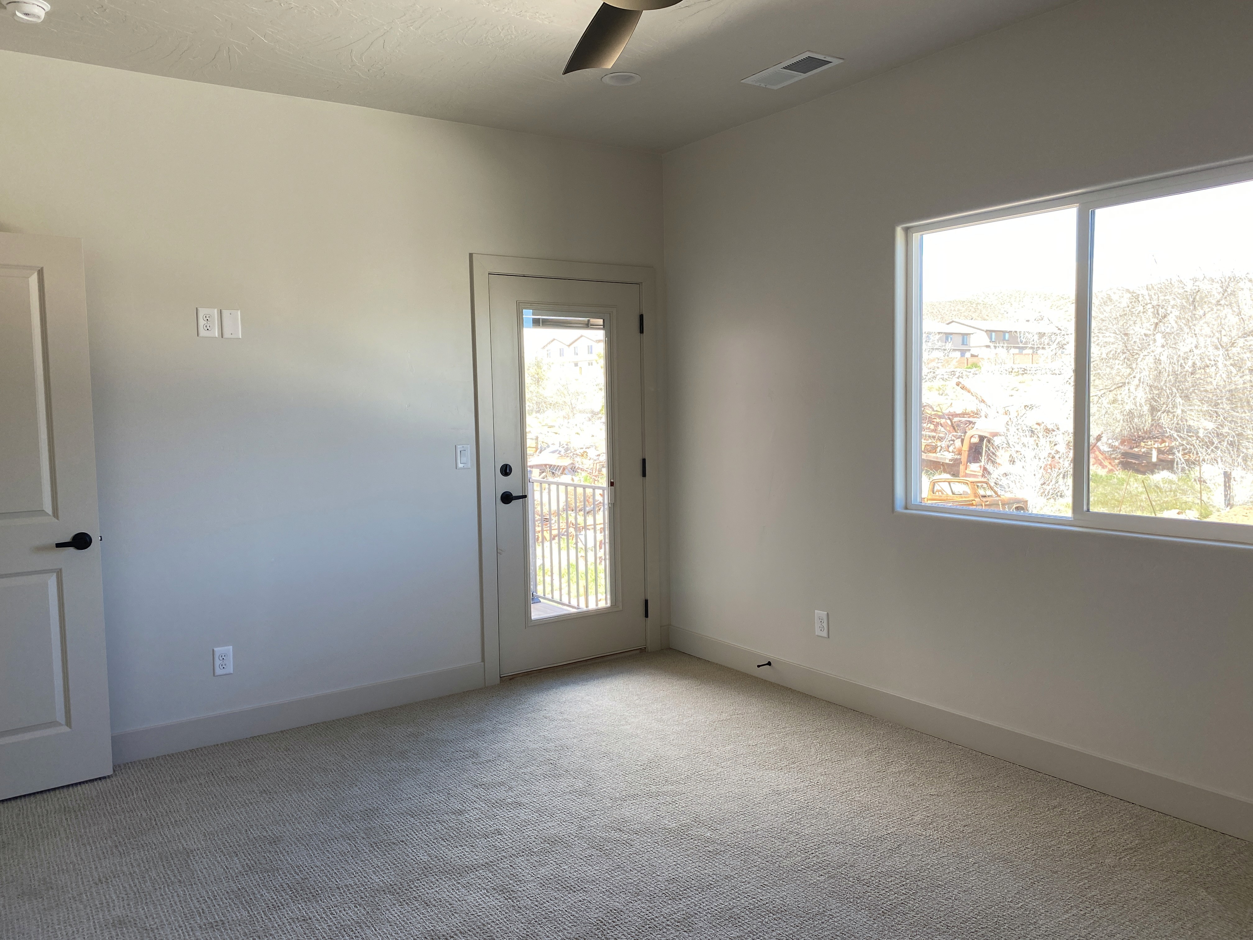 Bedroom in a Southern Utah duplex with natural light and practical layout.