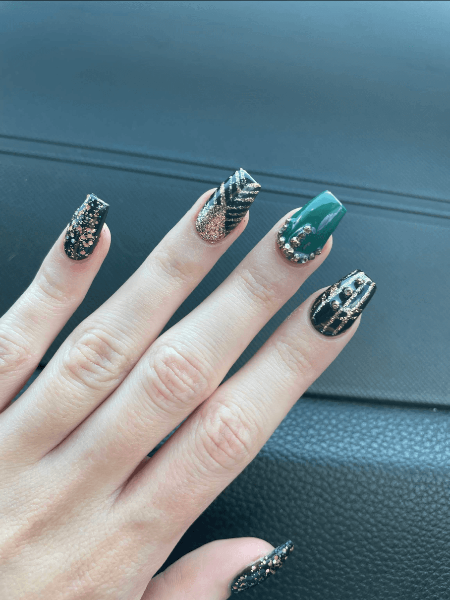 Hand with glittery pastel nails in sunlight