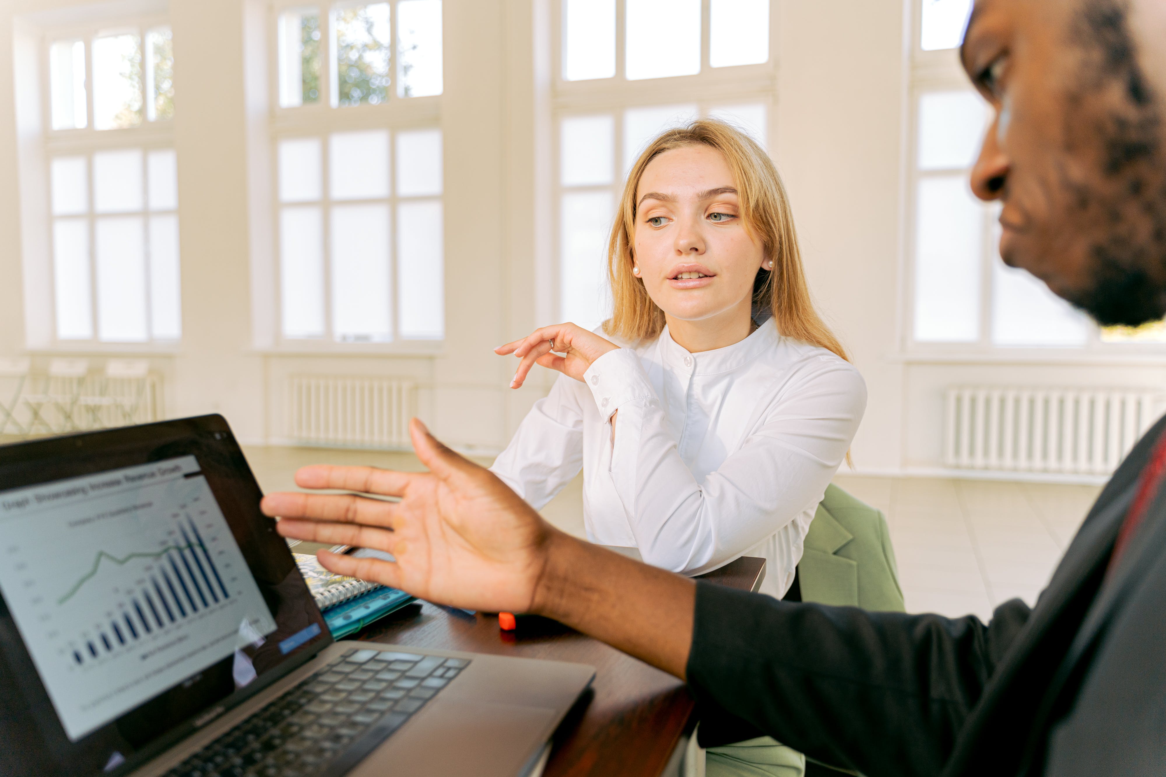 Man and woman discussing mortgage broker fees