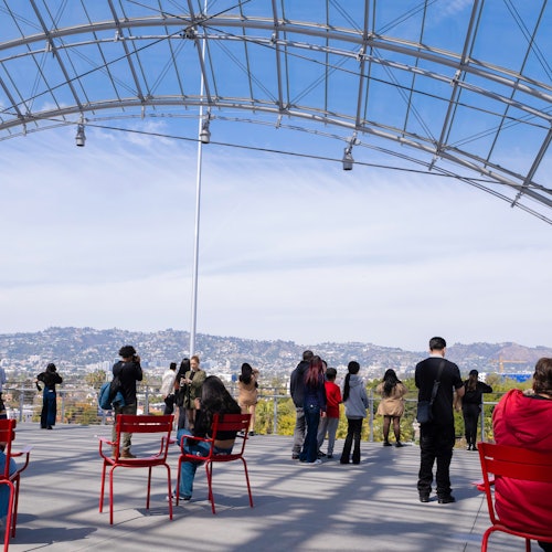 Guests seated and standing on our fifth floor terrace.