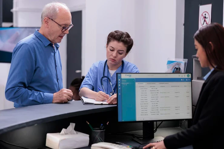 Staff helping patient with their billing