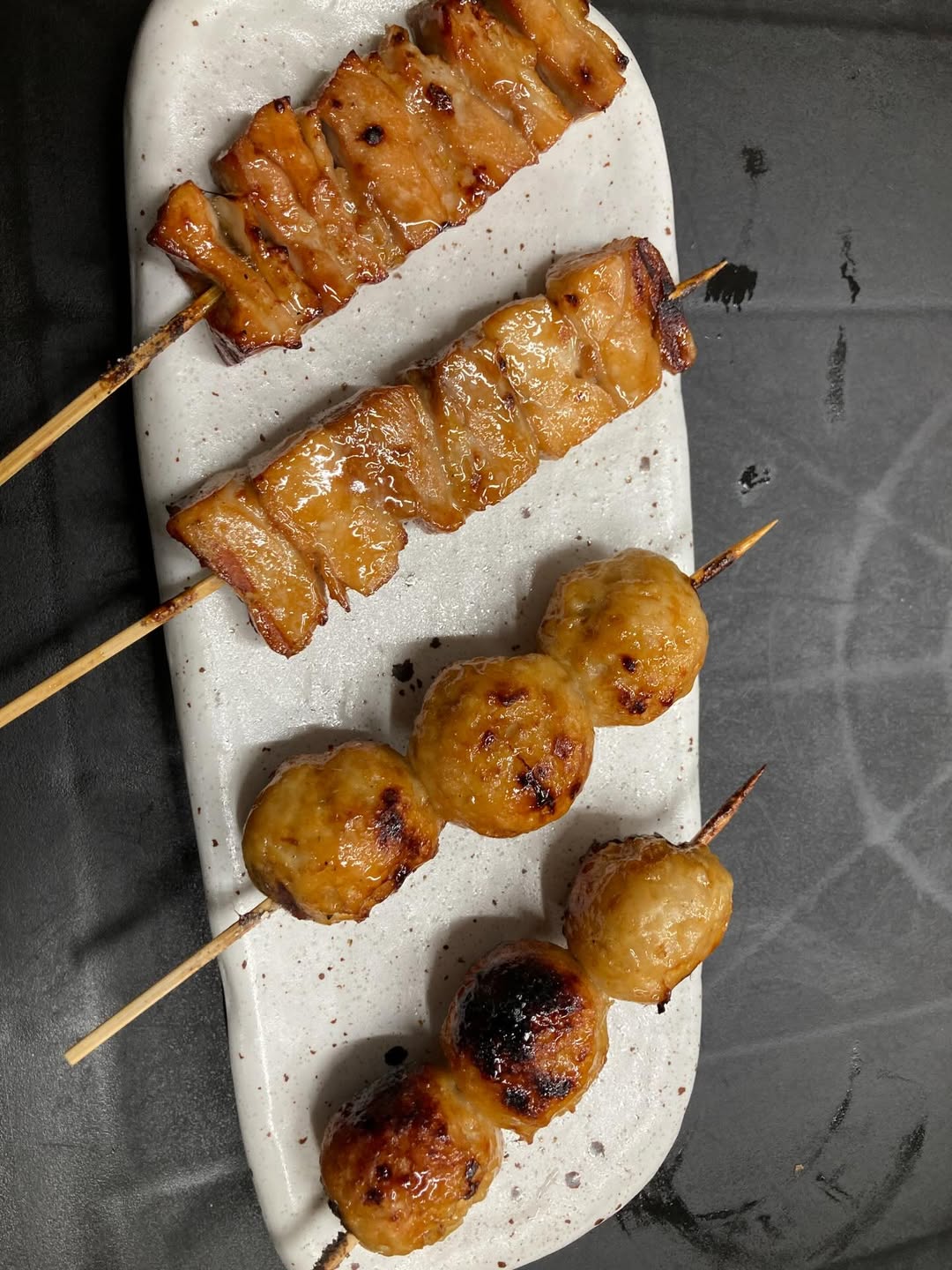 Bottles of olive standing on the marble counter
