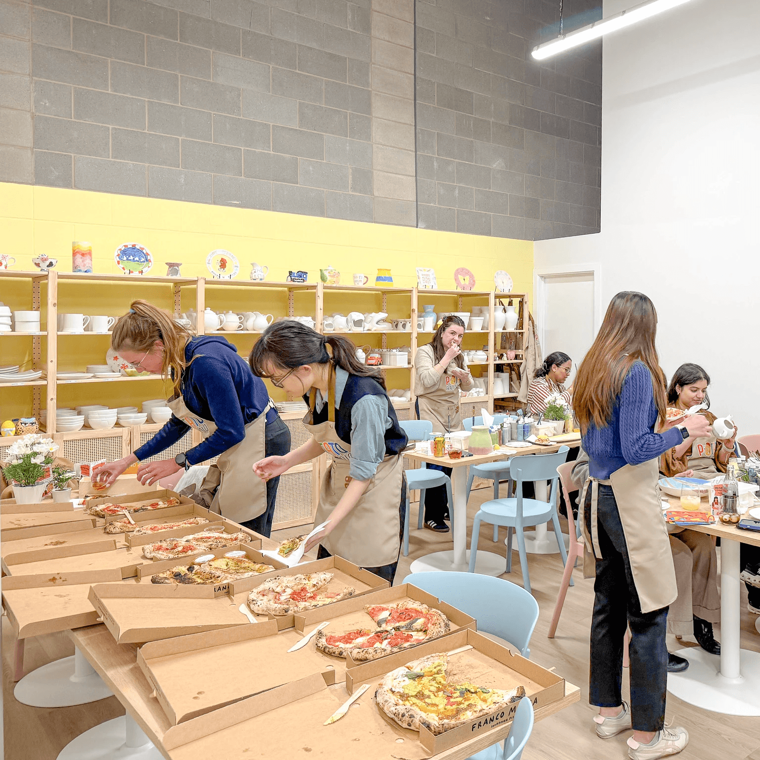 Corporate team enjoying a pottery painting workshop in London