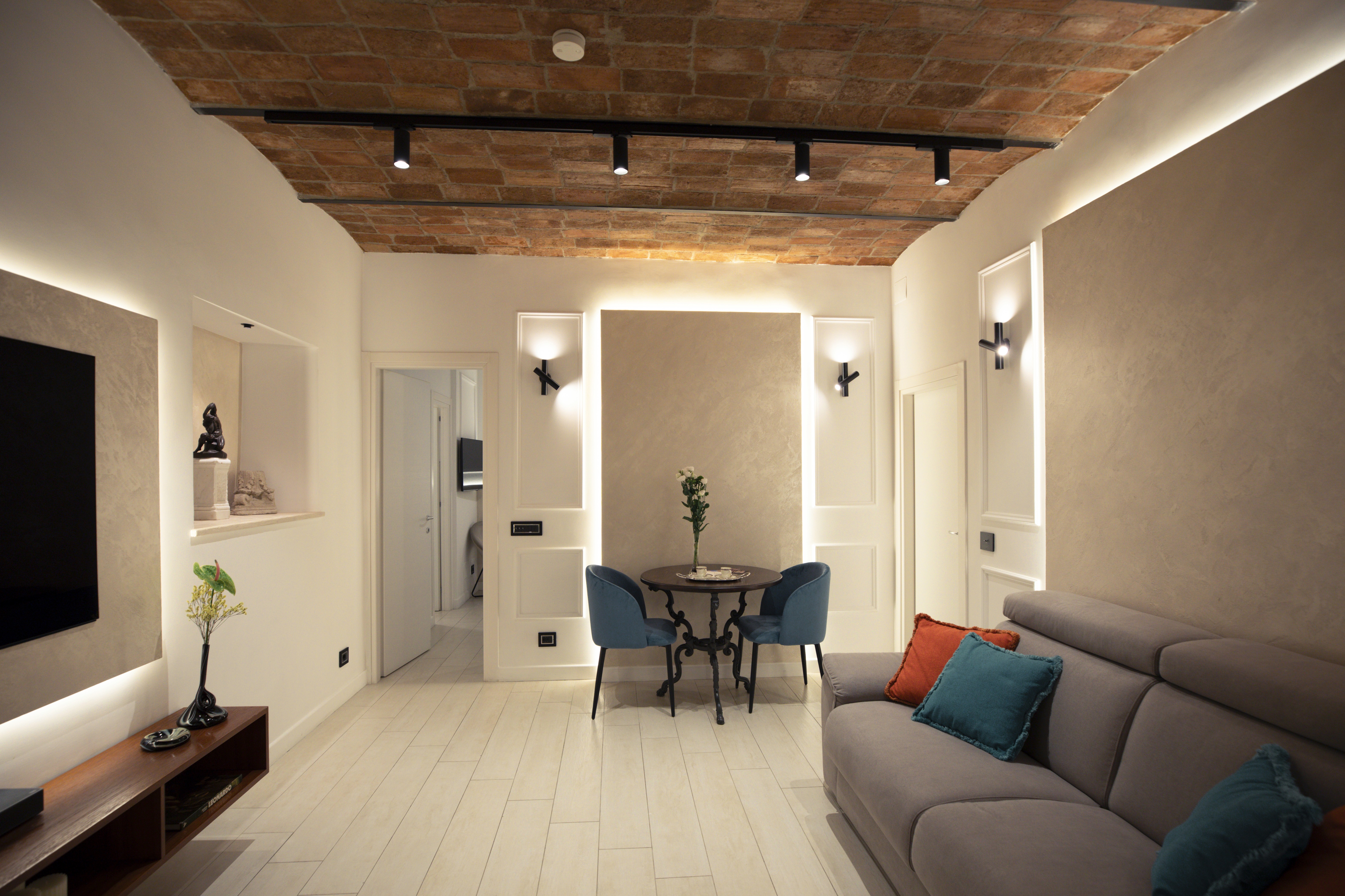A vintage-style hotel lounge with classic furnishings and decor.