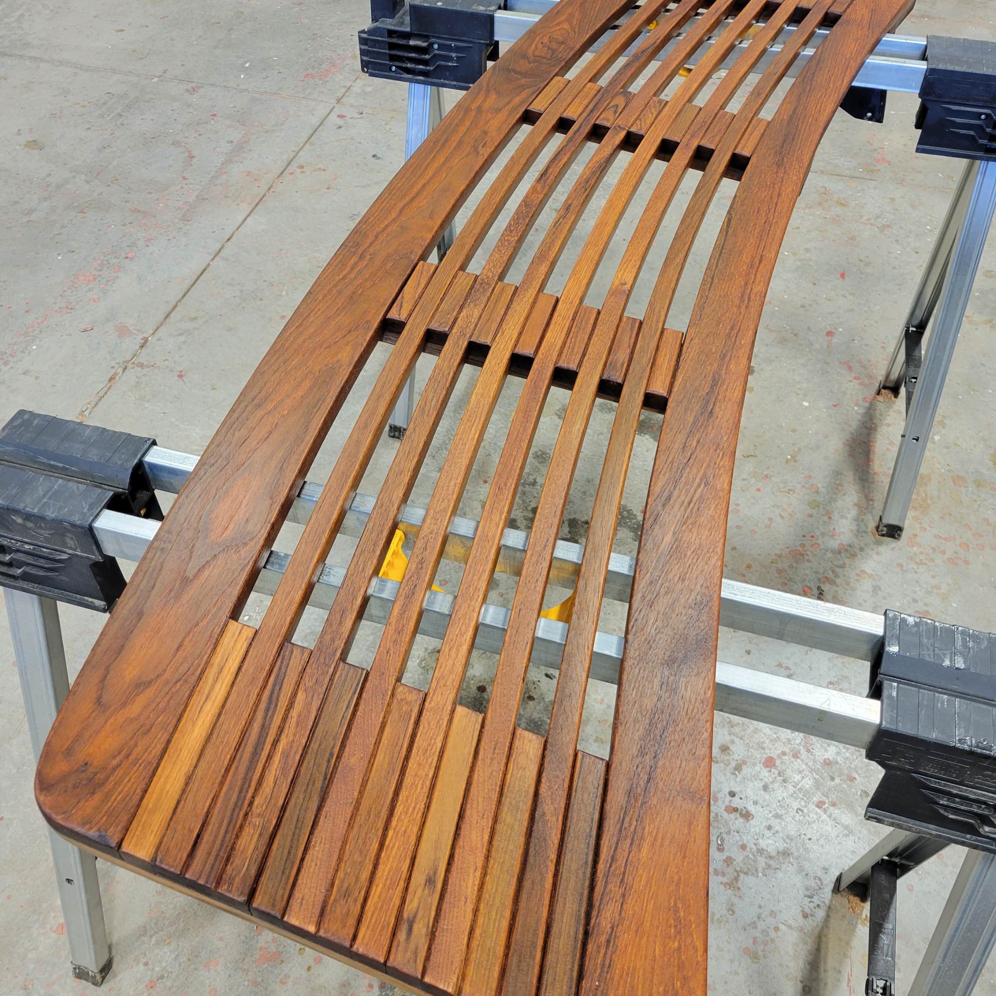 Teak swim platform on boat that has been restored to like new condition