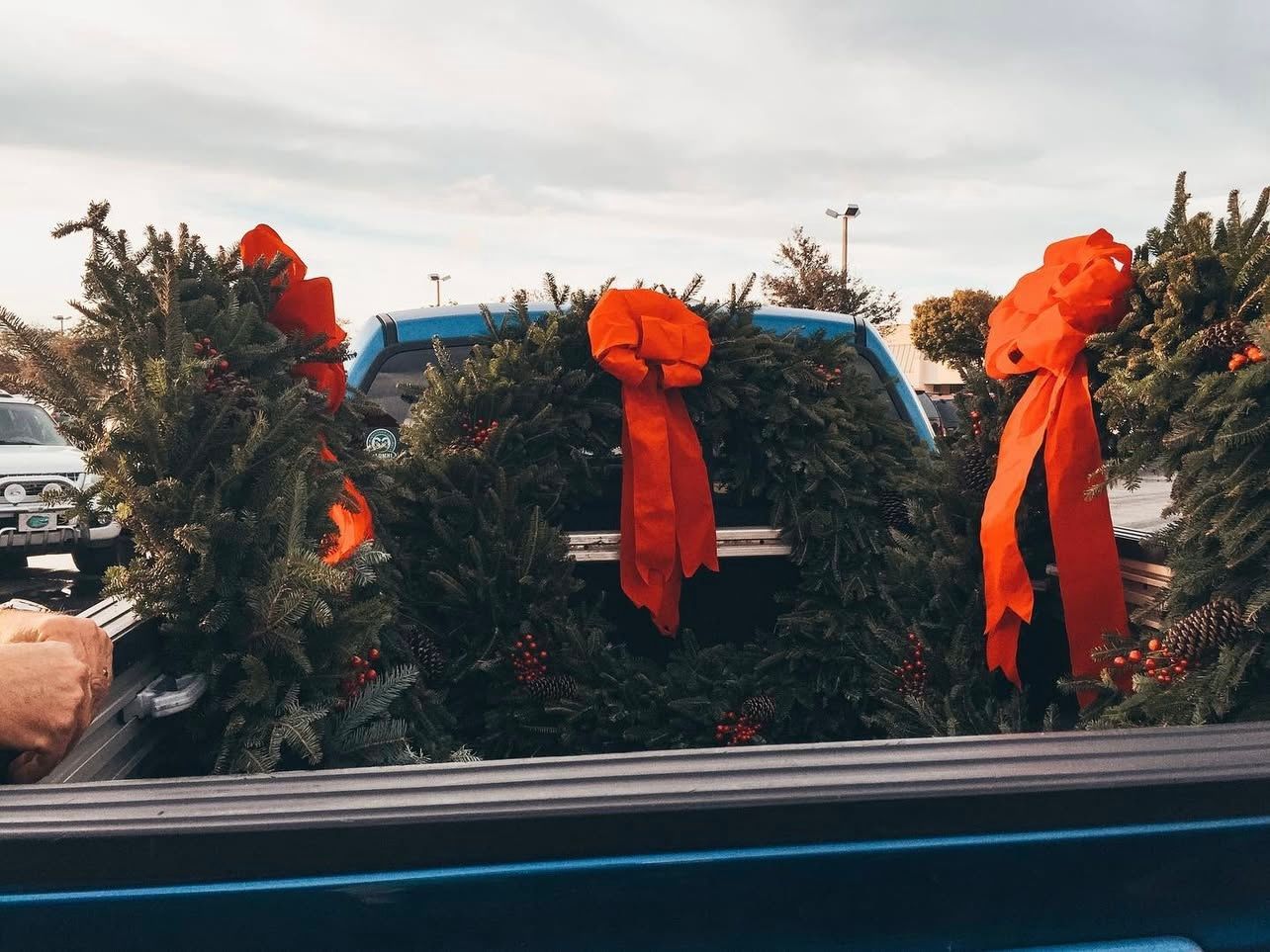 three hodge podge wreaths in the back of a truck