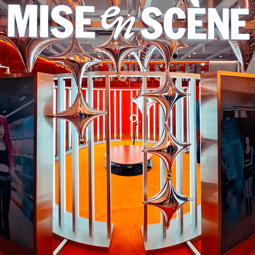 Black-and-white macro of a dandelion seed head on white—delicate botanical detail.