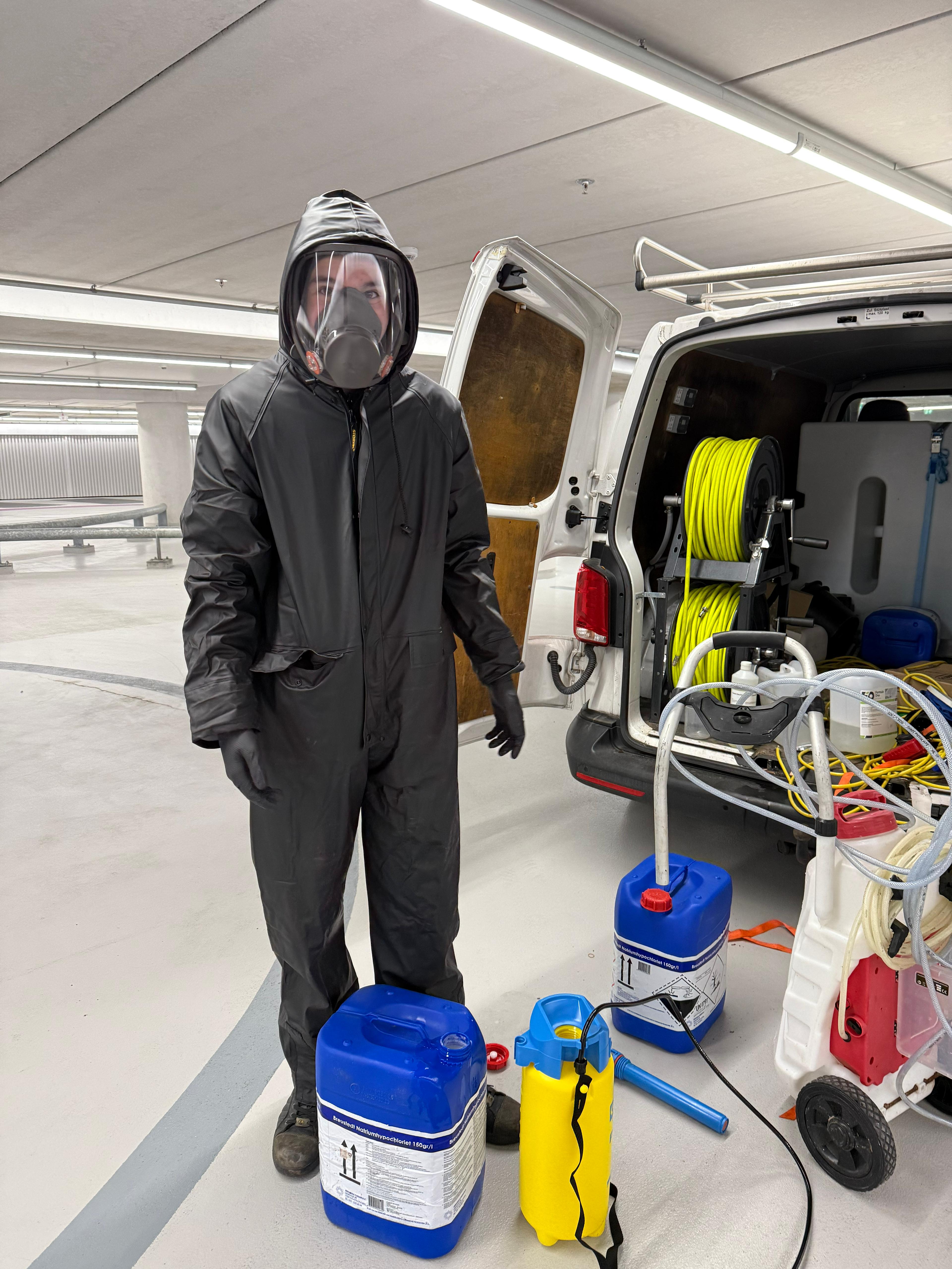 A diverse team collaborates around a table, analyzing documents and charts in a professional setting with a light green background.
