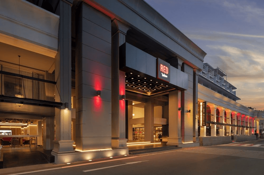 a woman in a swimsuit laying on the edge of a pool
