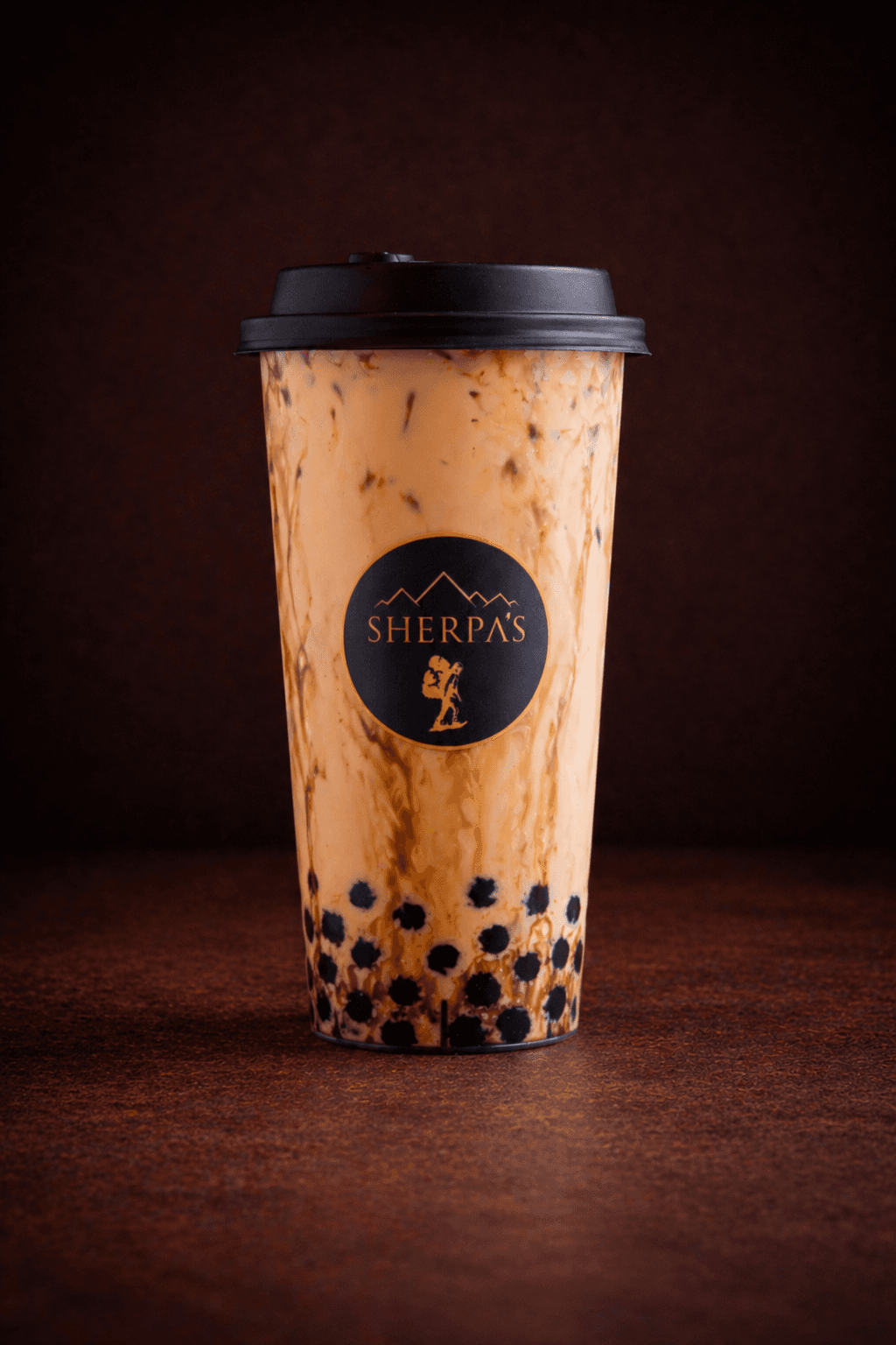 Ancient Brown Sugar Boba at Café Sherpa's in Brookfield, WI. Caramelized brown sugar milk tea with soft, chewy tapioca pearls.