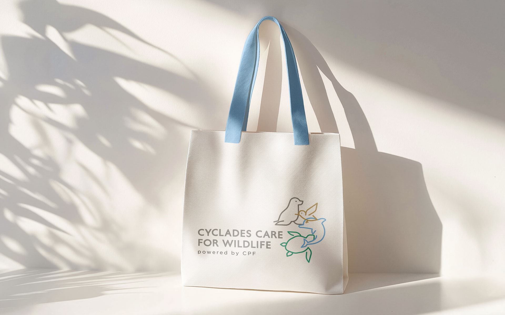 Branded tote bag design for Cyclades Care for Wildlife with a clean composition and recognizable graphic elements