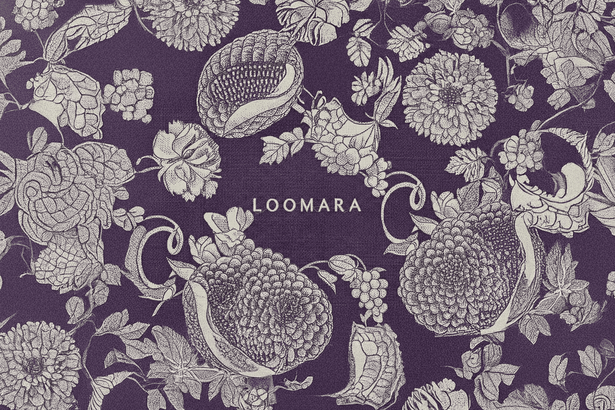 Close-up of Loomara textile sample with the Loomara logo intricately woven into the center, showcasing premium weave texture and brand integration