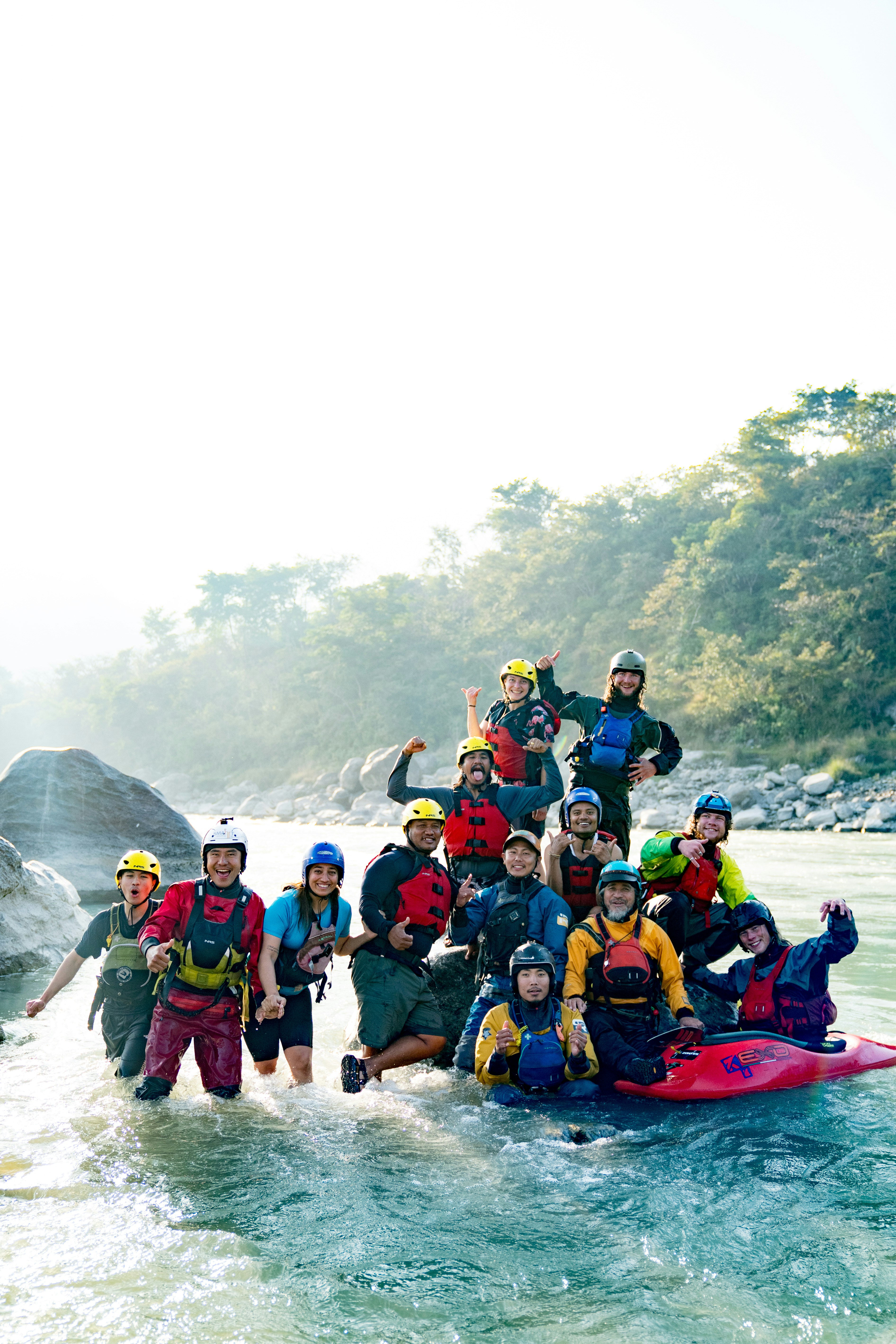 A group of people on a raft in a river