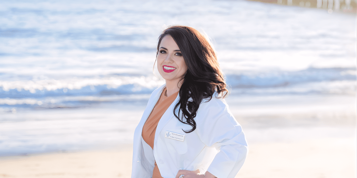 "Dr. Maes Vioula Rabadi, founder of SCV Chiropractic, stands by the ocean, representing holistic healing through chiropractic care and nutrition."