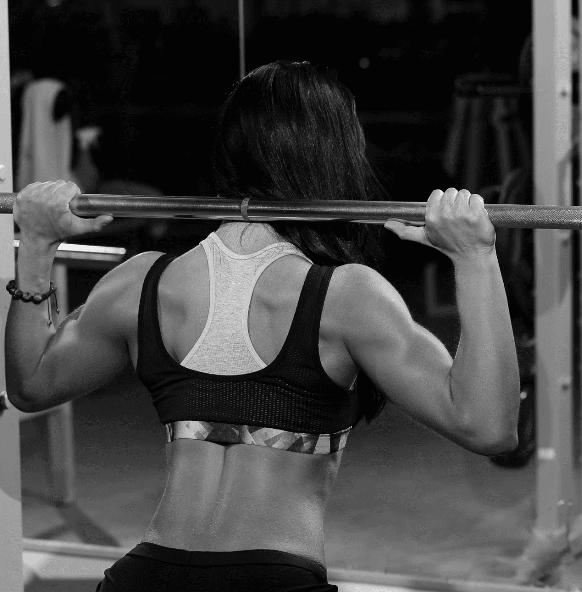 Woman maintaining form during body sculpting exercise