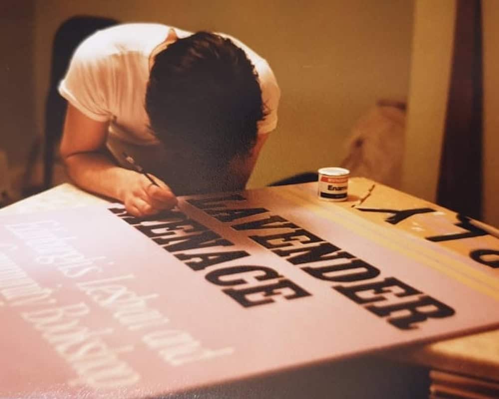 Painting a Lavender Menace sign. Credit: Alison Orr