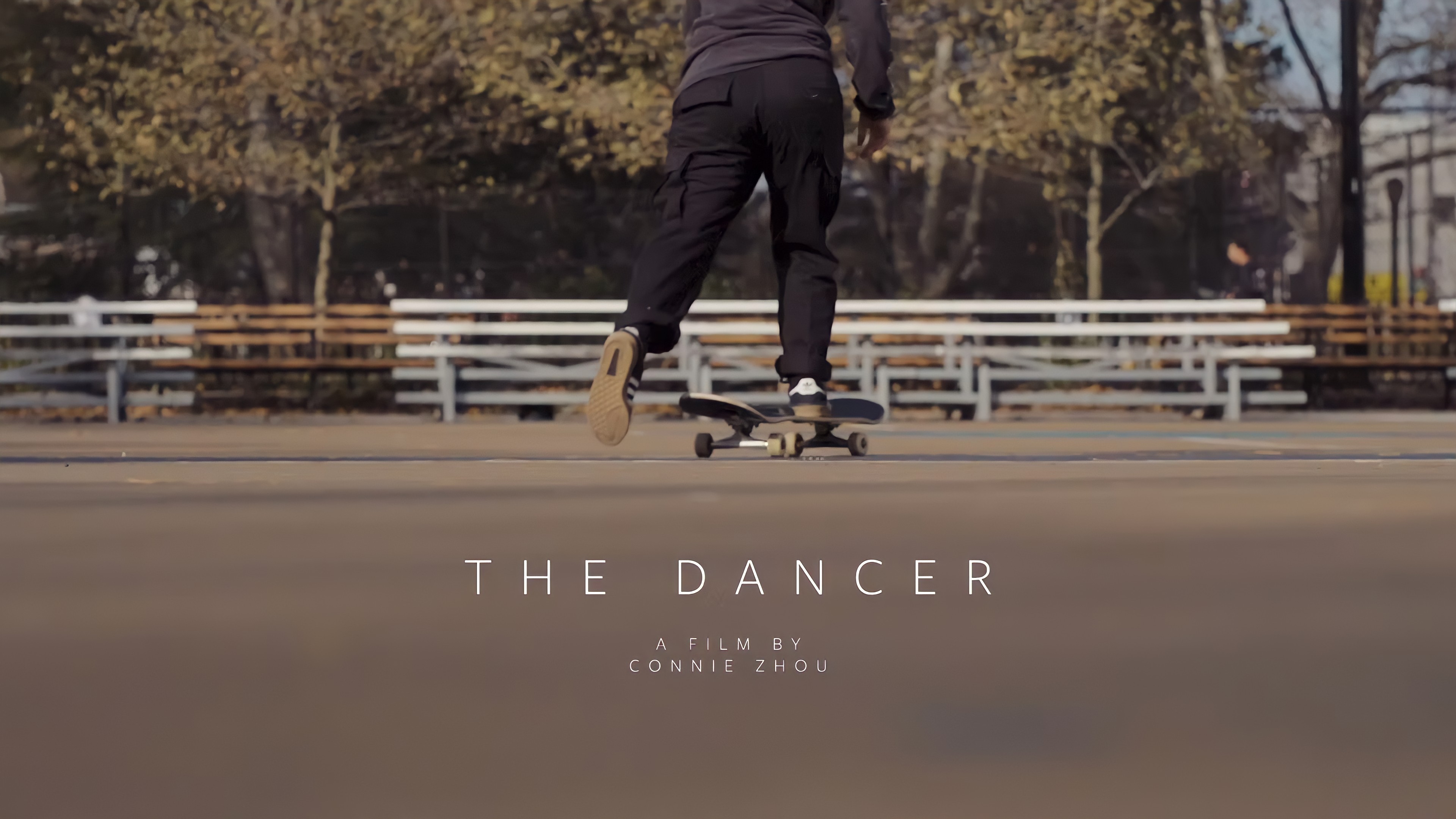 Back of a woman skateboarding
