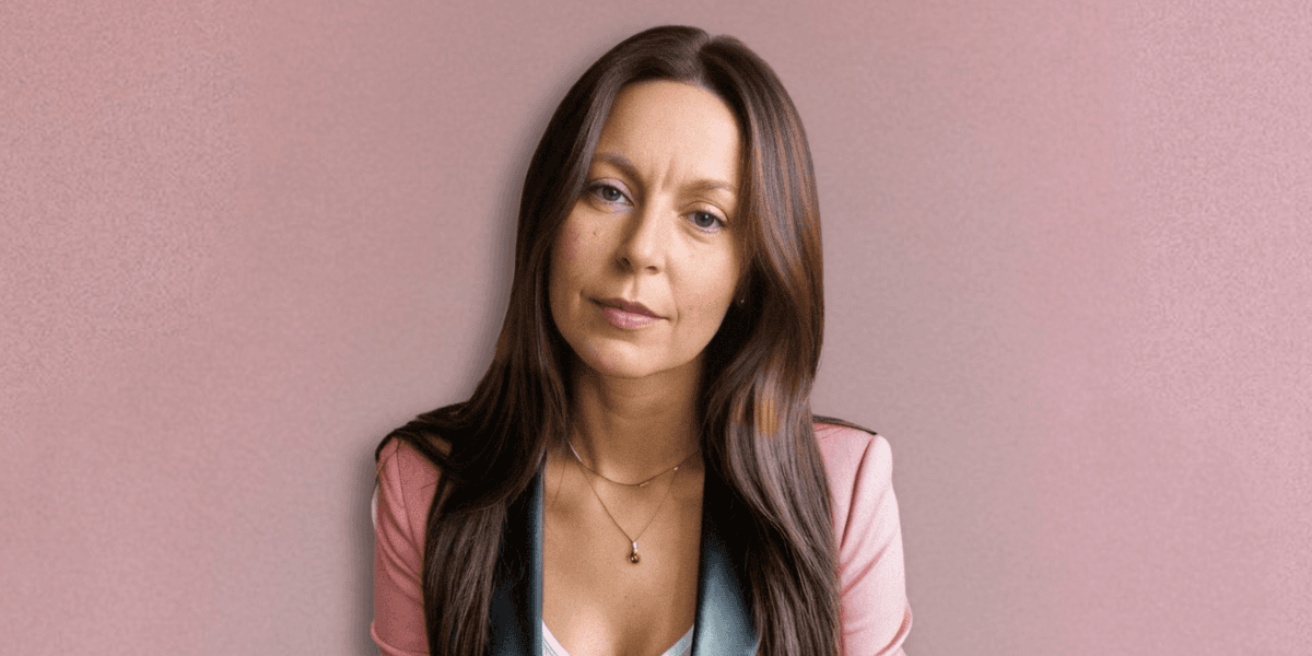 A professional portrait of Dr. Millie Lytle, a naturopathic doctor and energy medicine expert, with long brown hair.