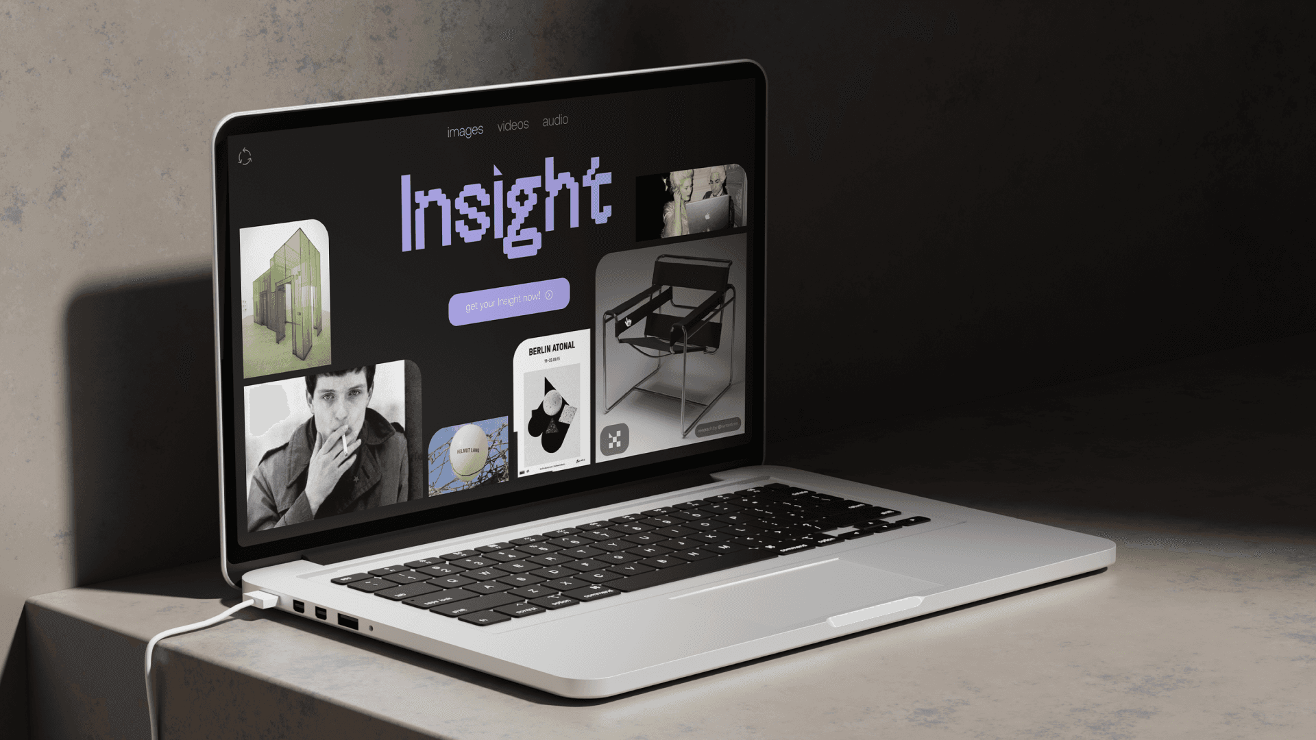 Laptop showing web design by Aleksandr Portianko for Insight AI, featuring vibrant colors, a clean layout and dynamic elements. A modern design that emphasizes creativity and user experience