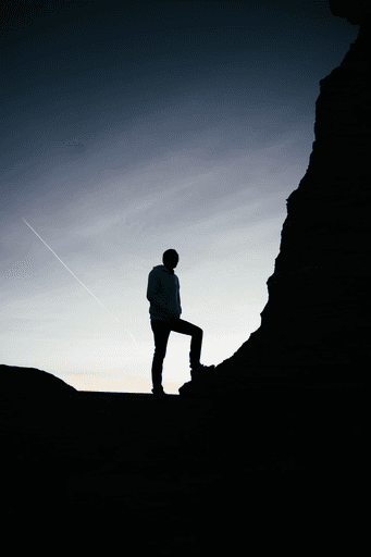 A man climbing a mountain