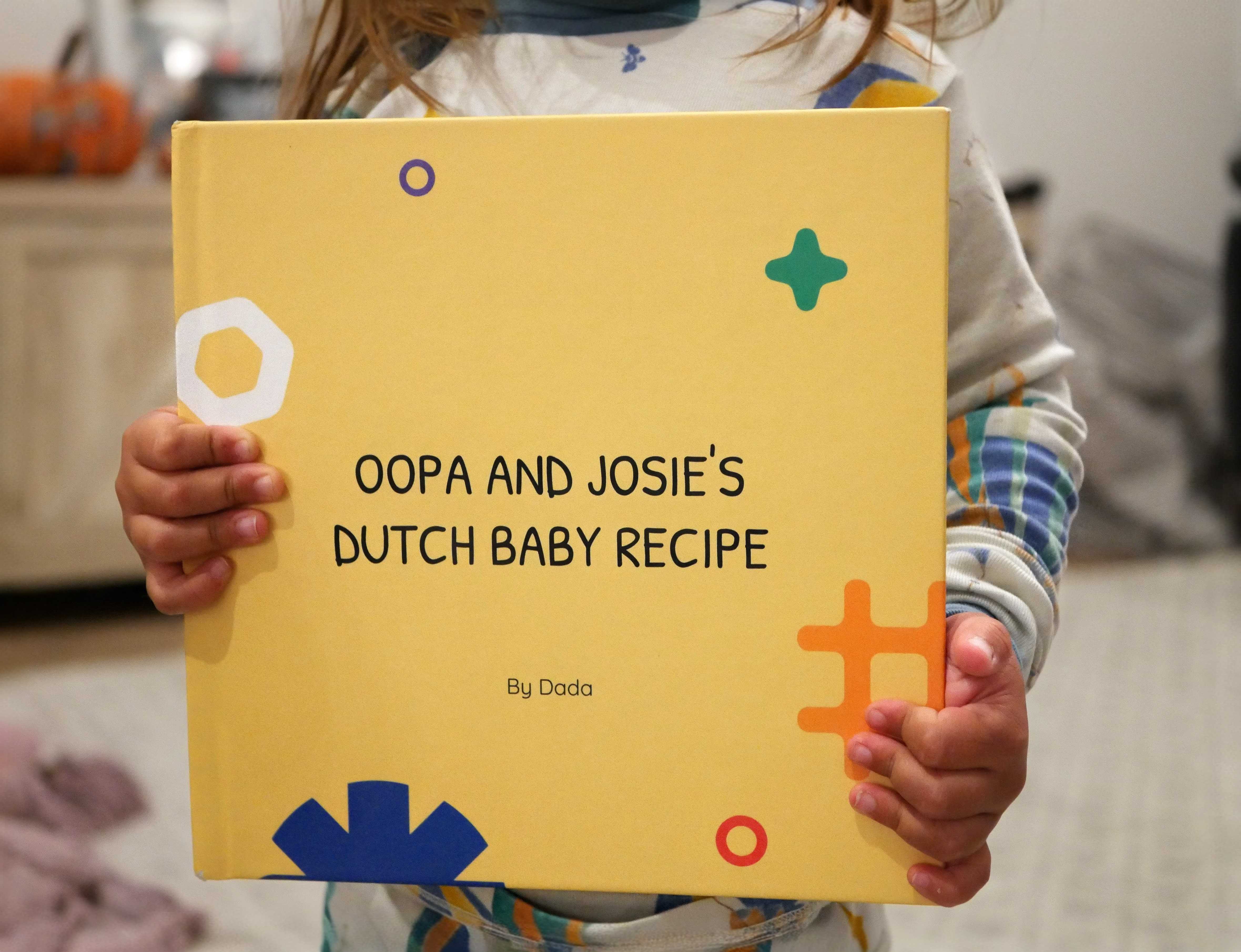 Close-up of a dark green leaf showing its textured surface and central vein against a muted background.