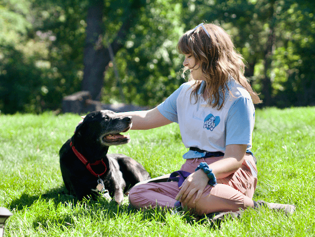 Megan professional dog walker with two dogs