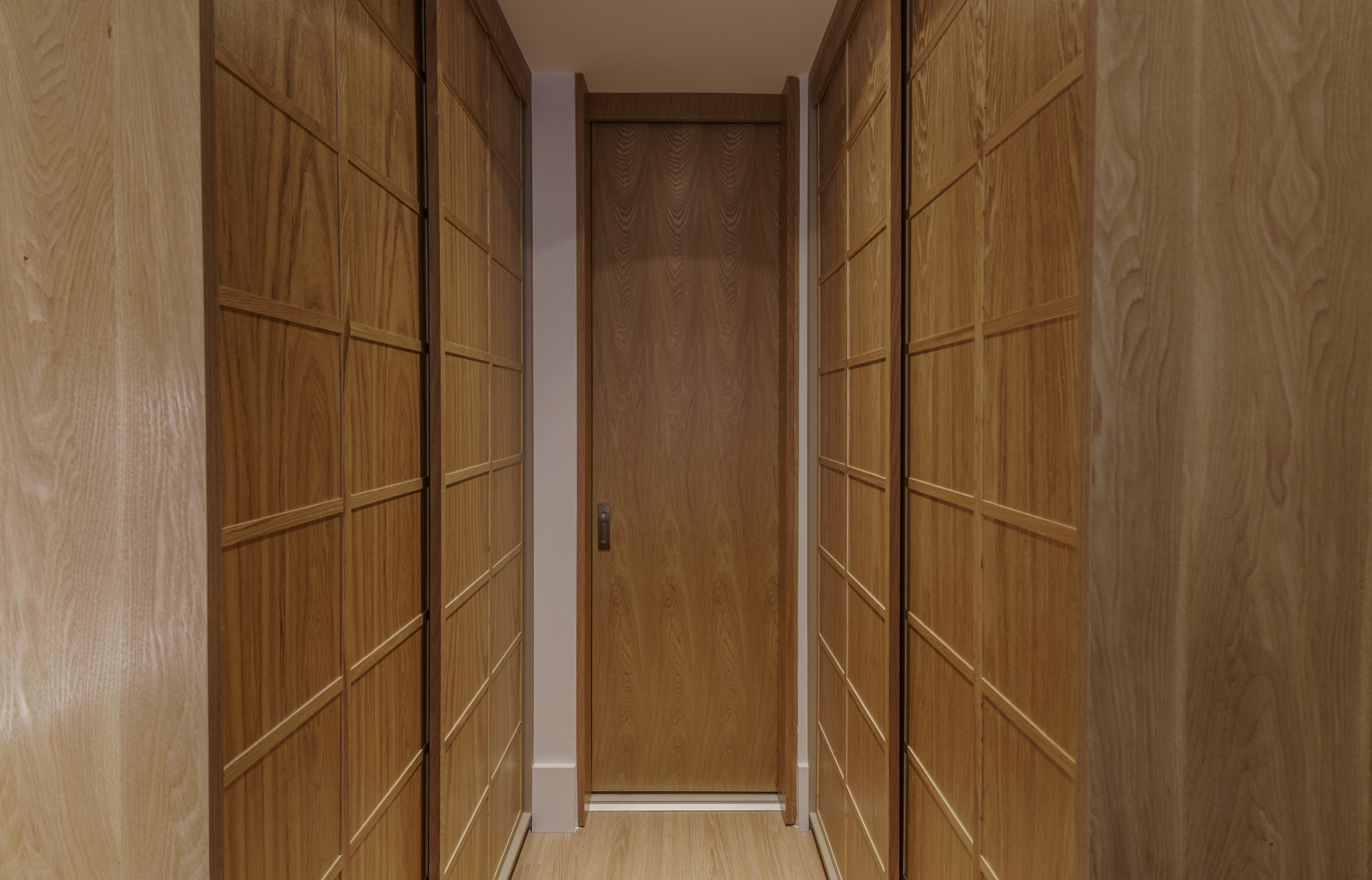 Double-height interior with flowing sculptural forms and warm raking light