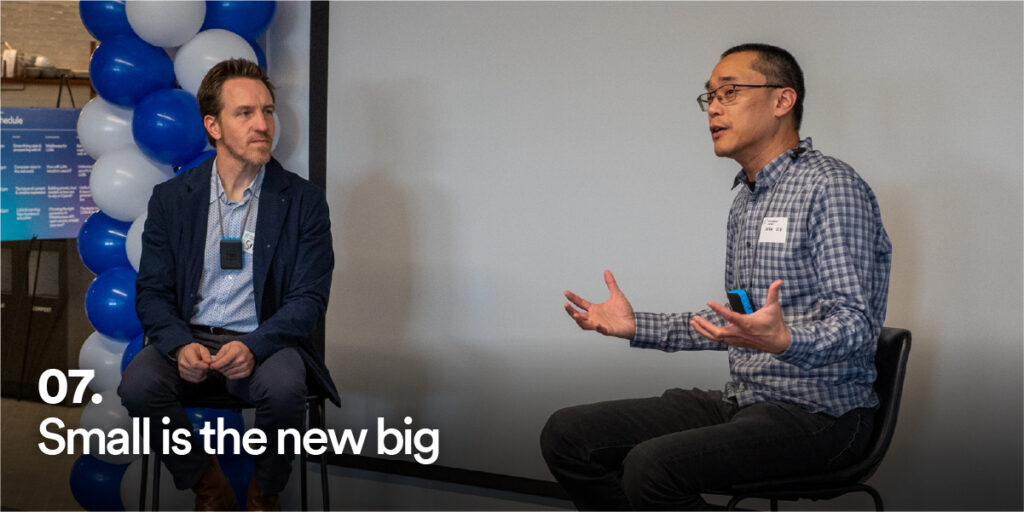 People at Generative AI Unconference with the text "Small is the new big"