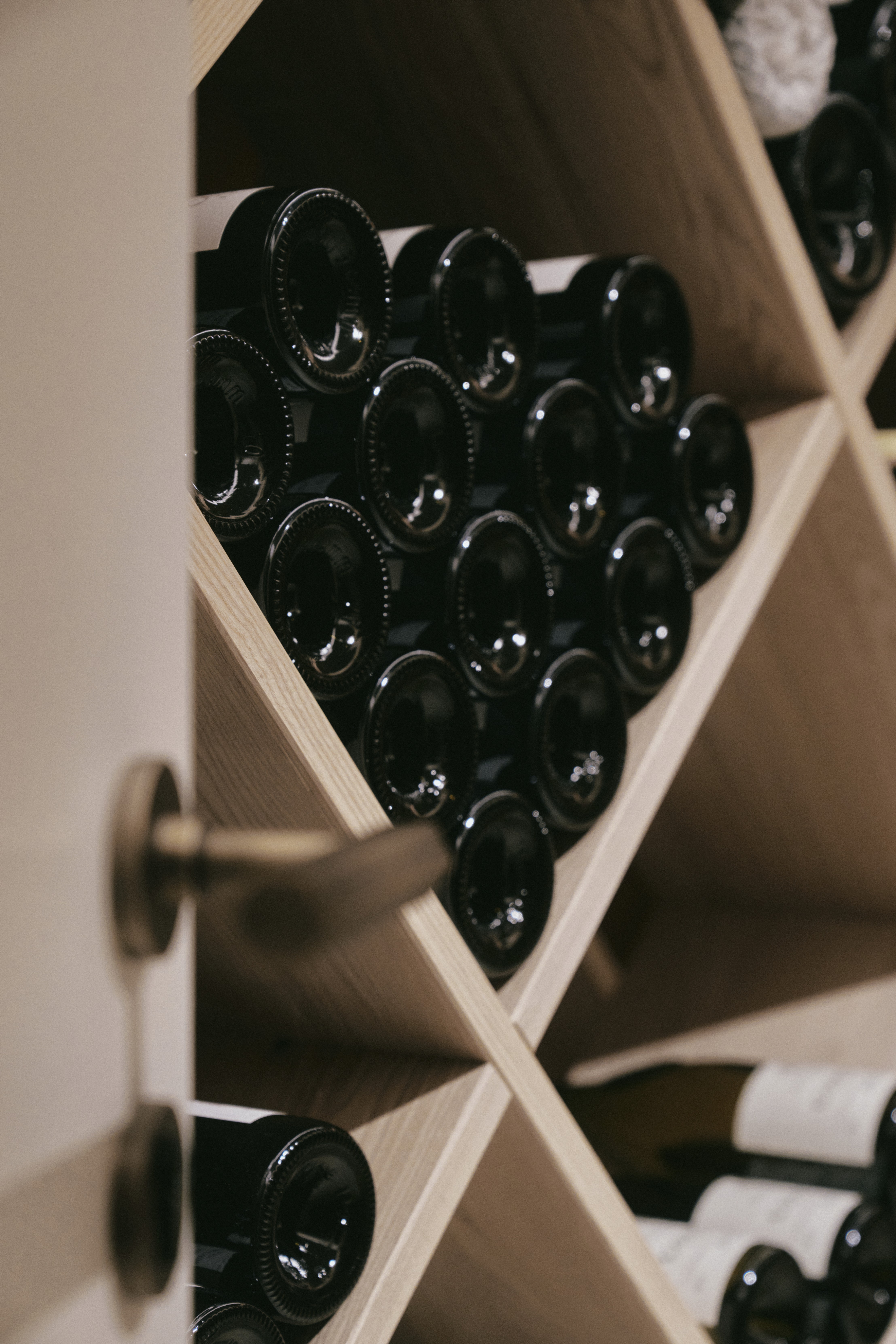 three people having a toast using three clear crystal wine glasses