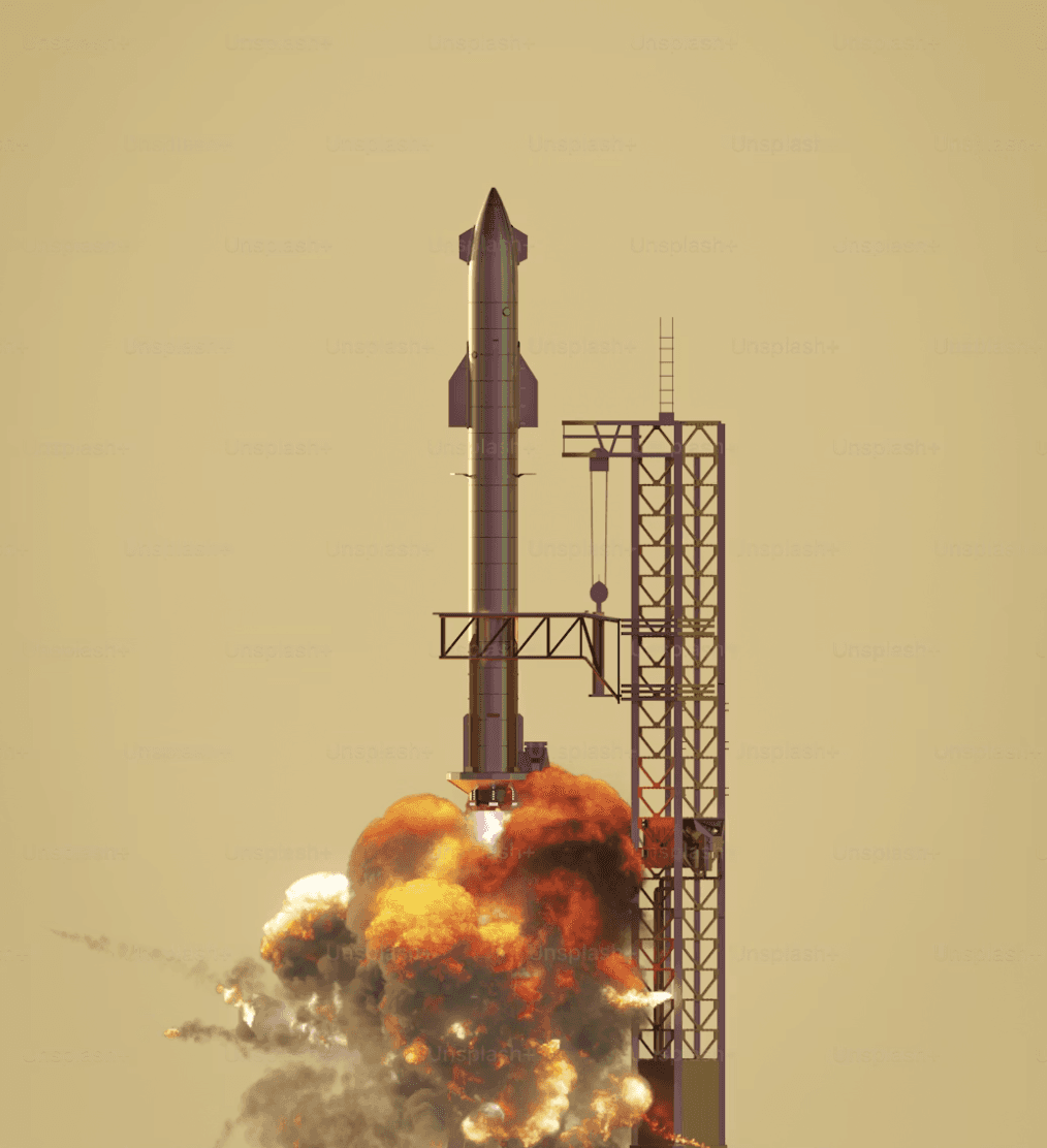 Aerial view of a winding road cutting through rocky terrain with patches of grass.