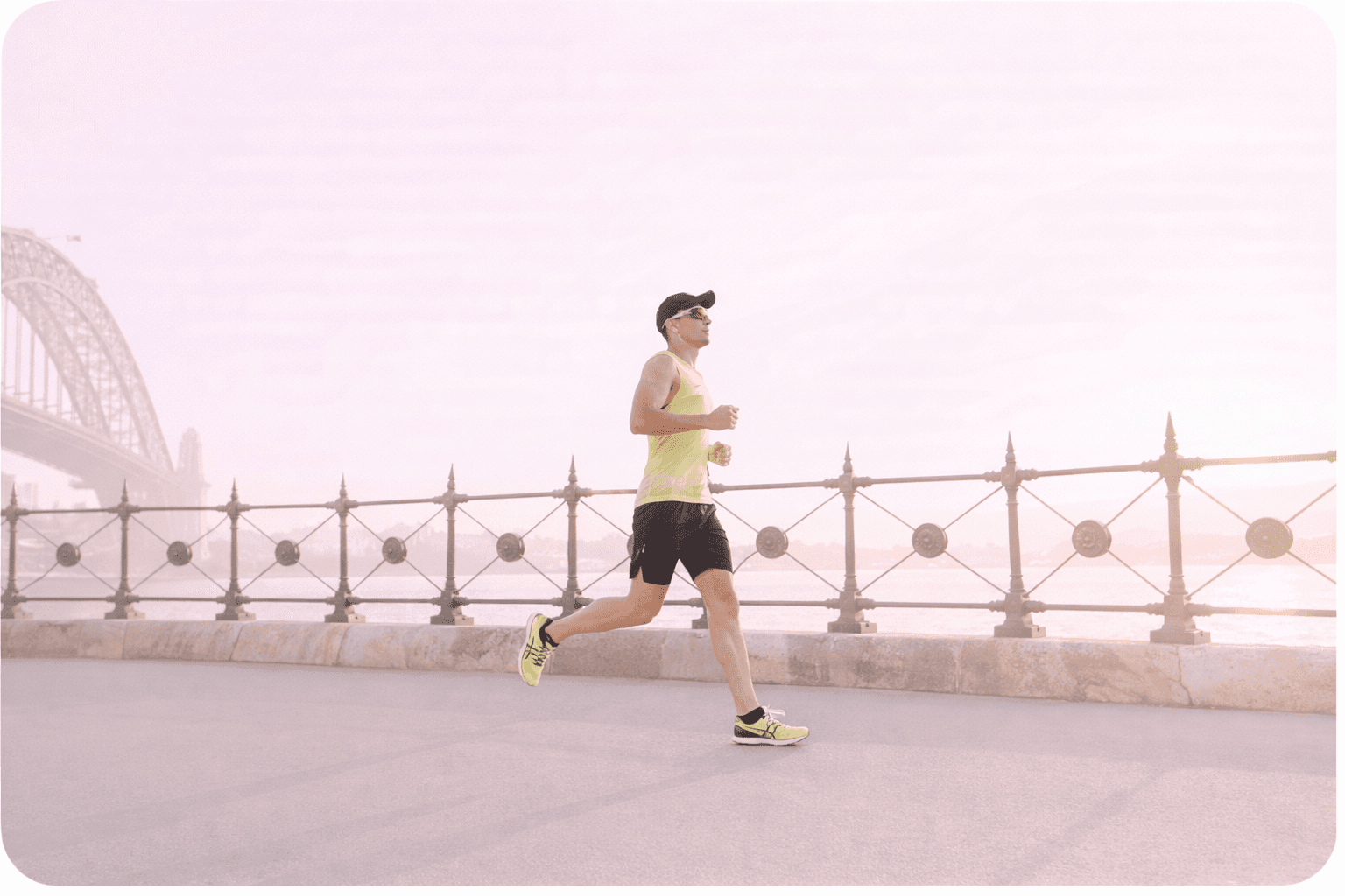 man in yellow tank top running near shore