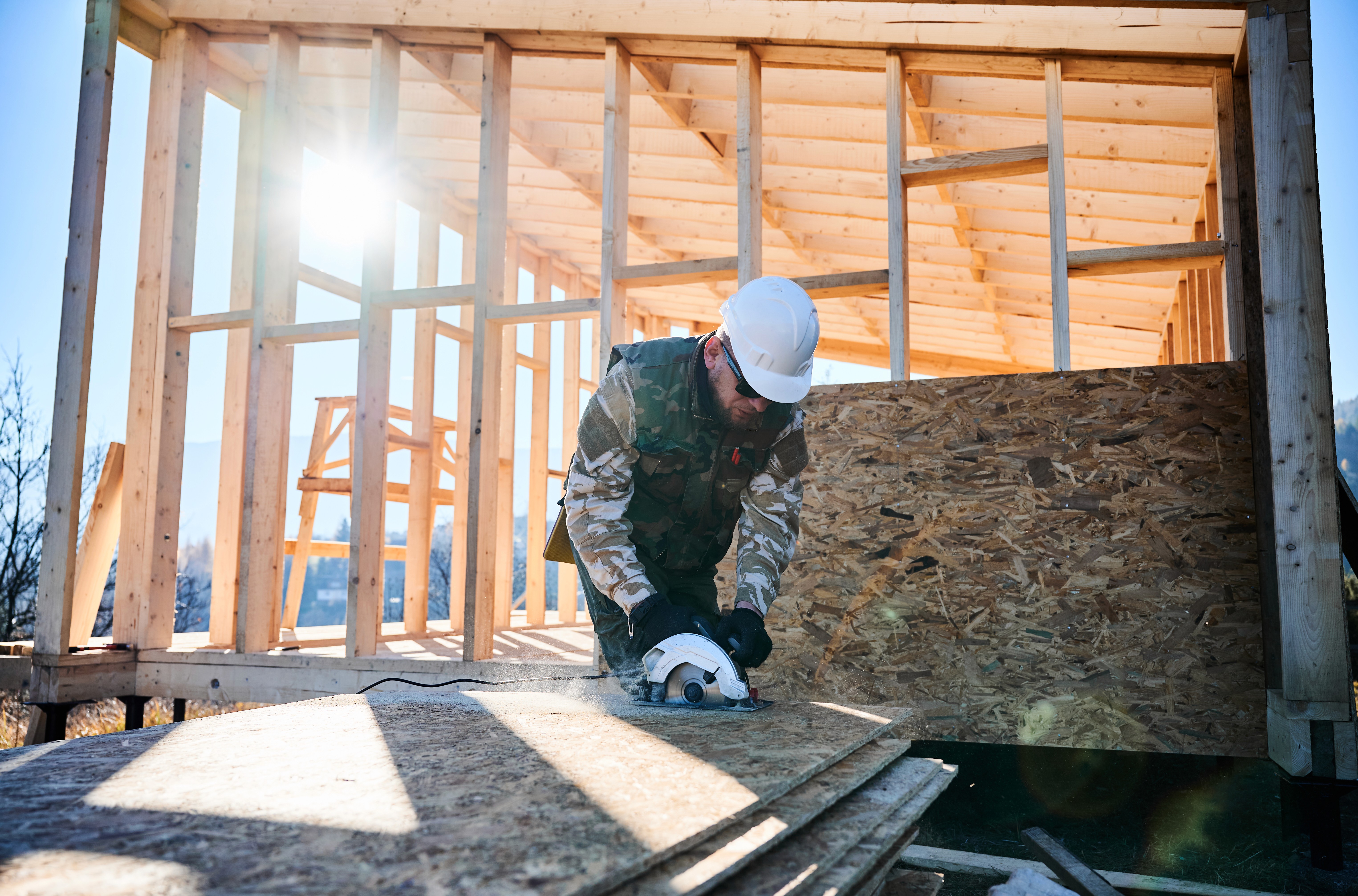 Commercial construction crew reviewing project plans on site