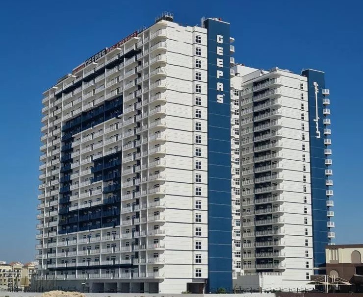 Full exterior view of Geepas Tower showcasing its massive scale and professional property management.