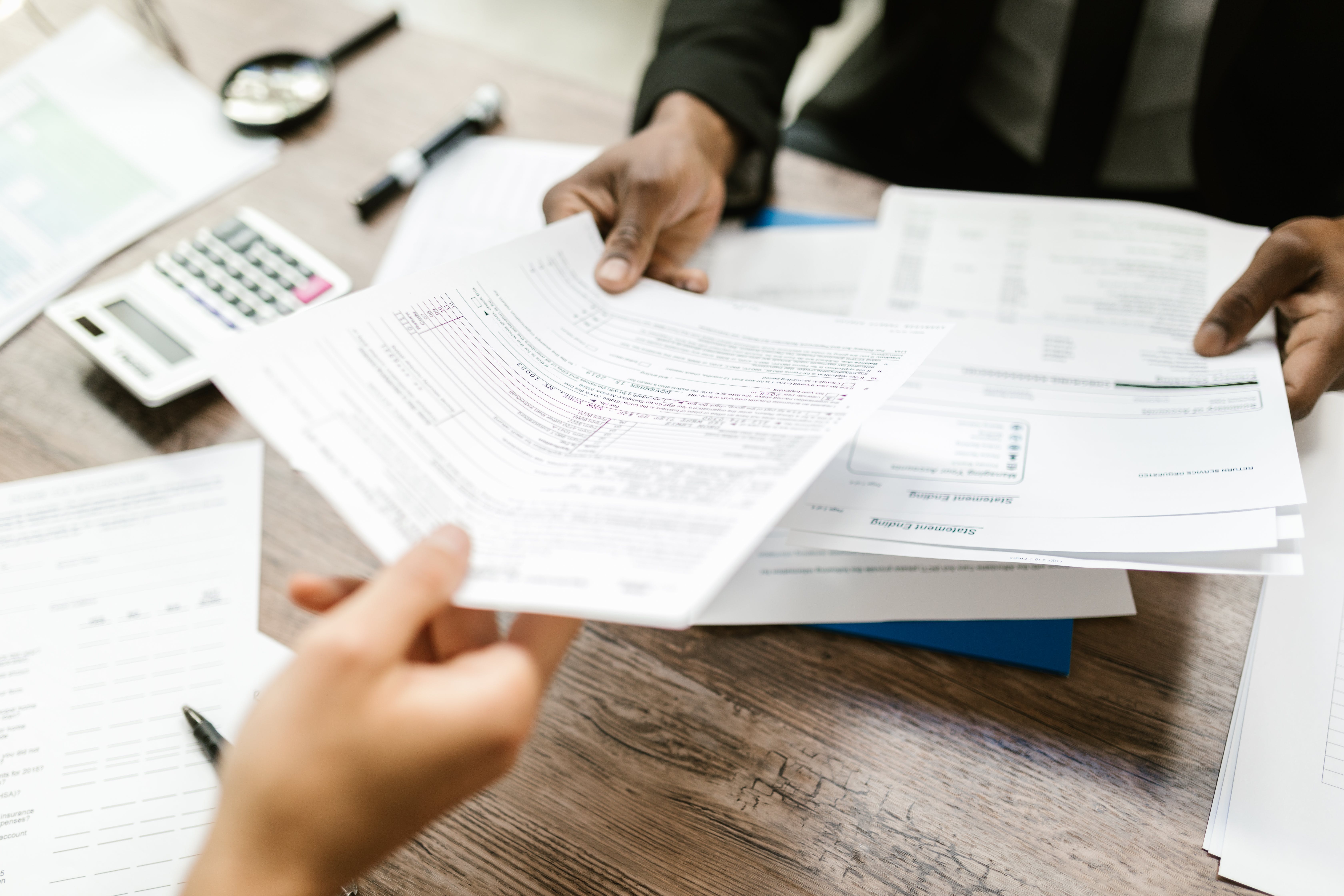 Man signing a mortgage protection contract