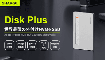 A male figure's head and shoulders illuminated by vibrant neon blue and orange light