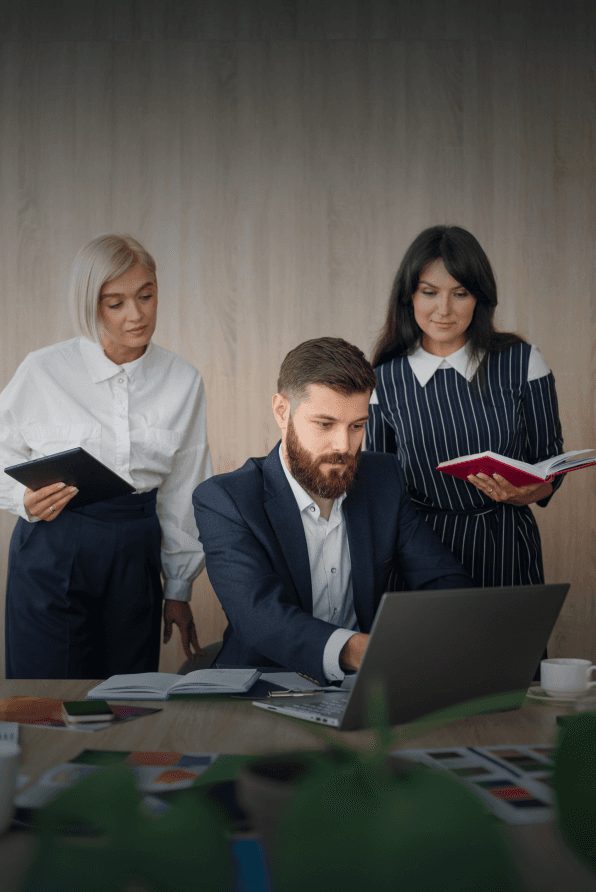 Image of office with 3 people